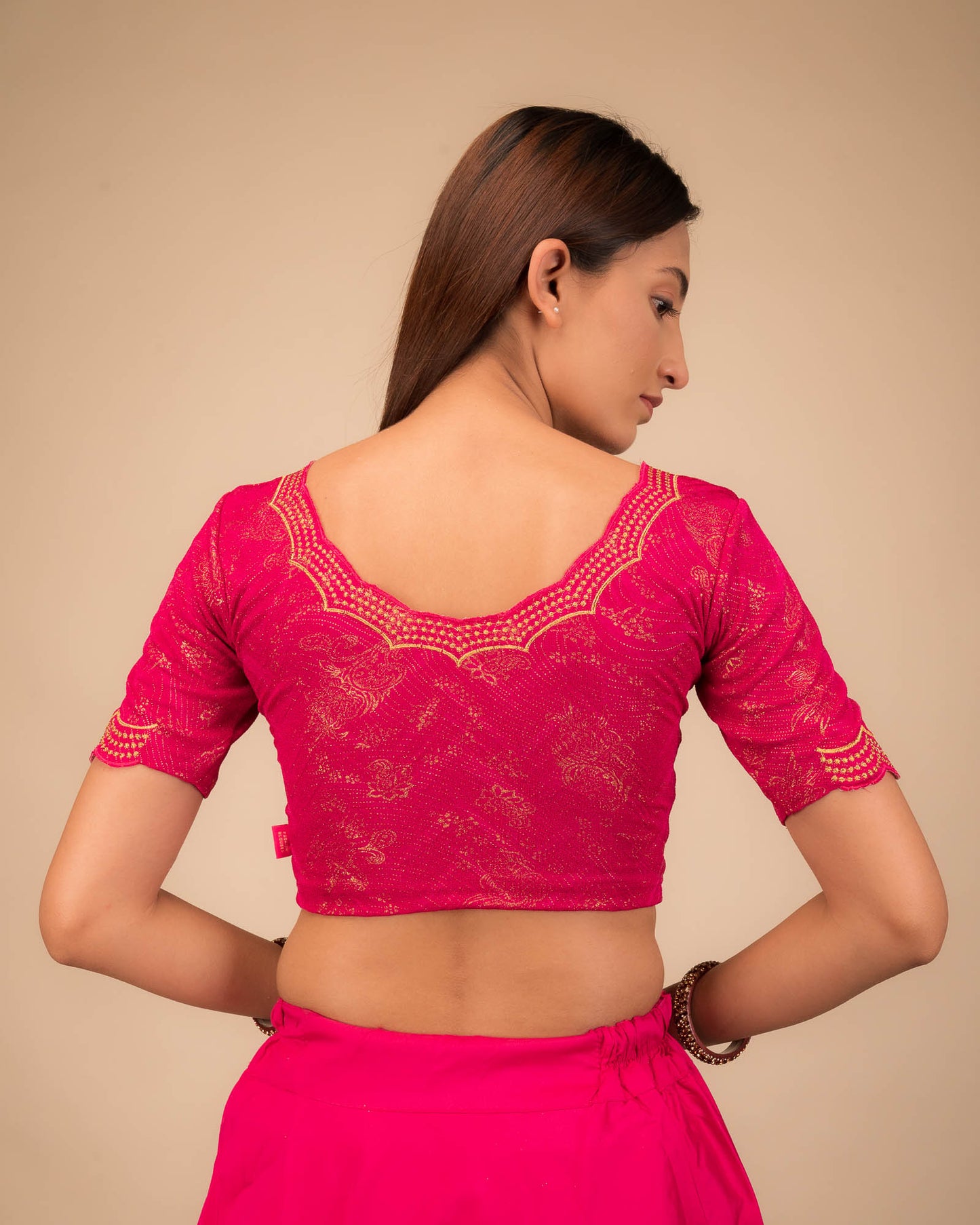 Rear view showcasing the blouse’s back design.