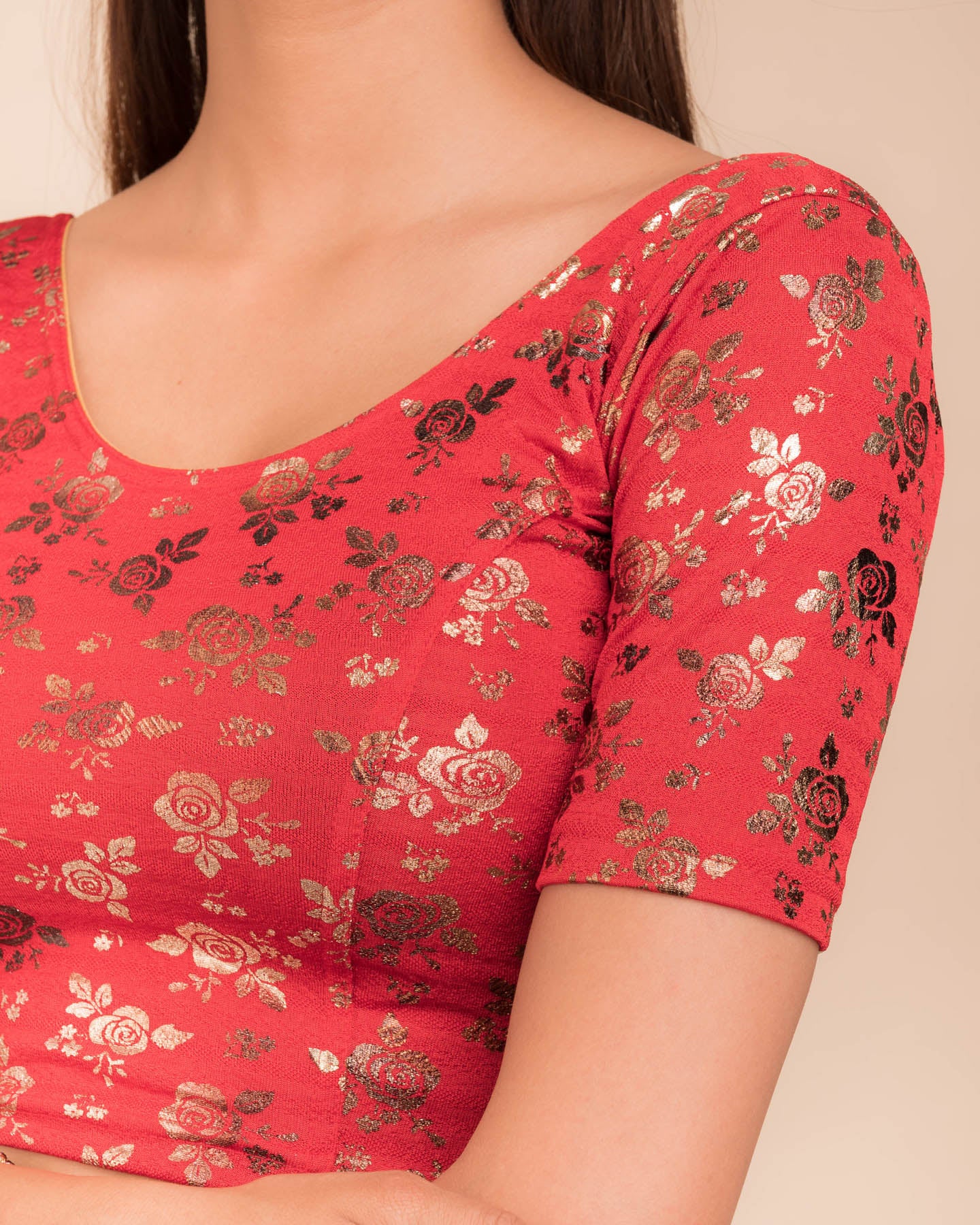 Close-up of the textured fabric with foil floral detailing.