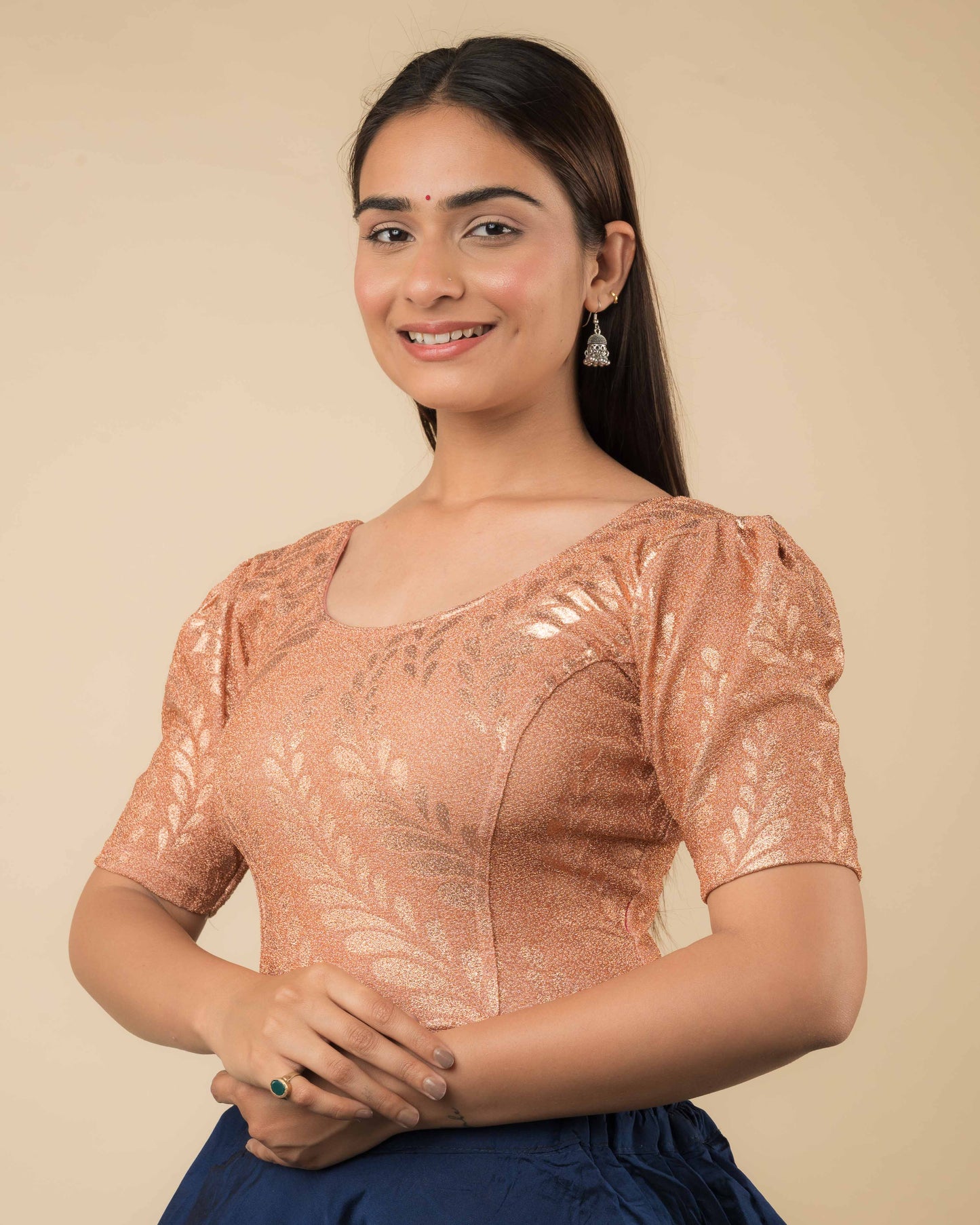 Side profile of metallic zari stretchable blouse highlighting fit, rose print design, and sleeve structure.