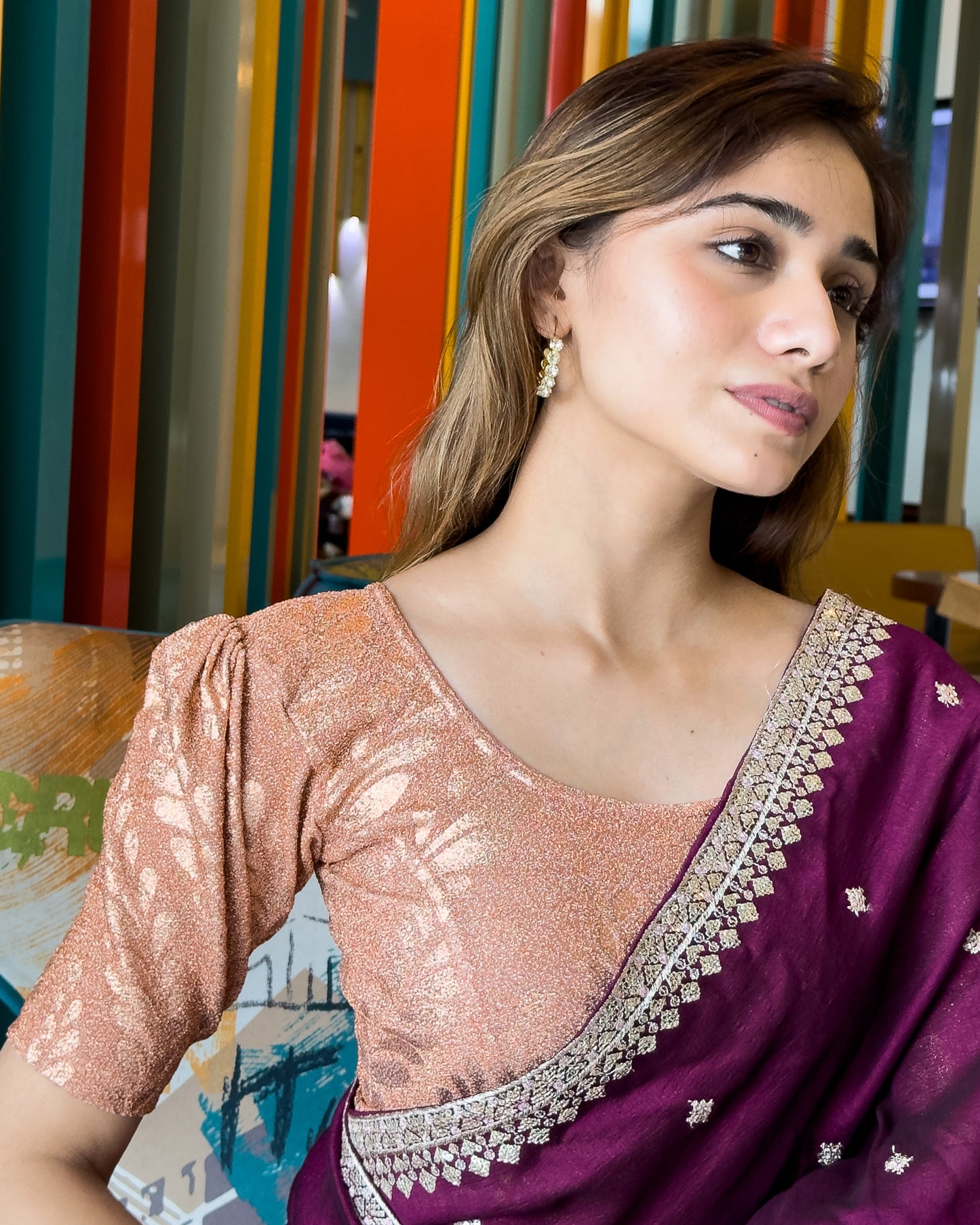 Model pairing metallic zari stretchable blouse with saree for a festive ethnic look.