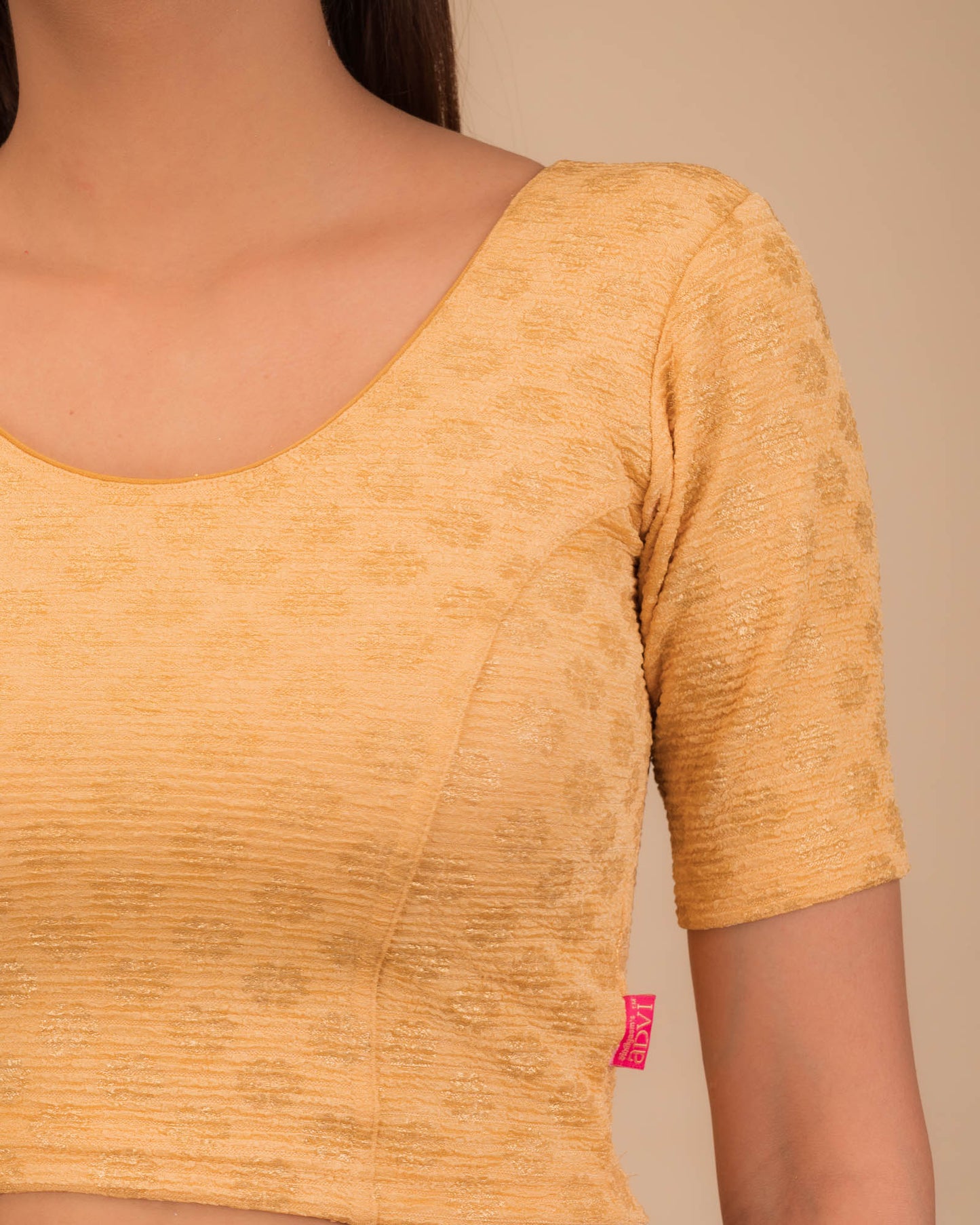 Close-up of jacquard knit with foil floral pattern.