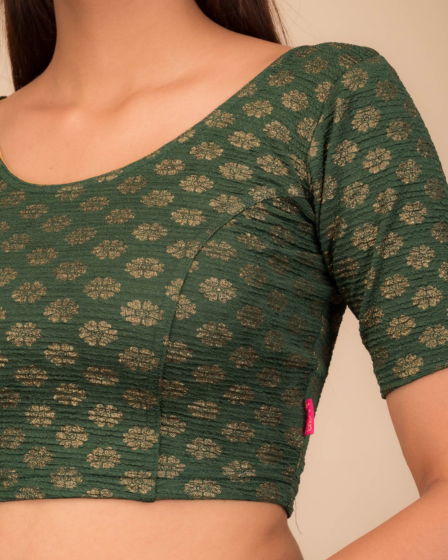 Close-up of jacquard knit with foil floral pattern.