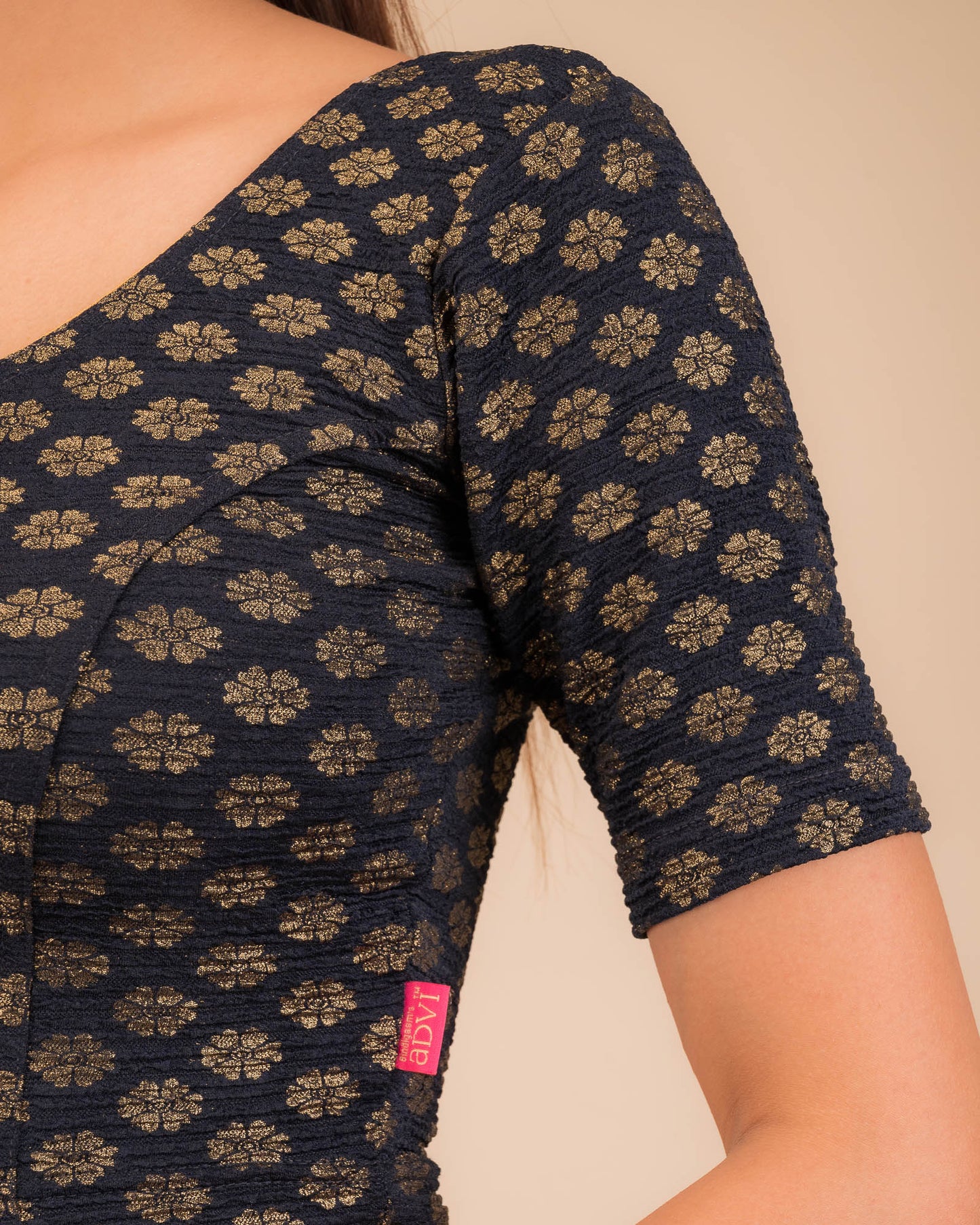 Close-up of jacquard knit with foil floral pattern.