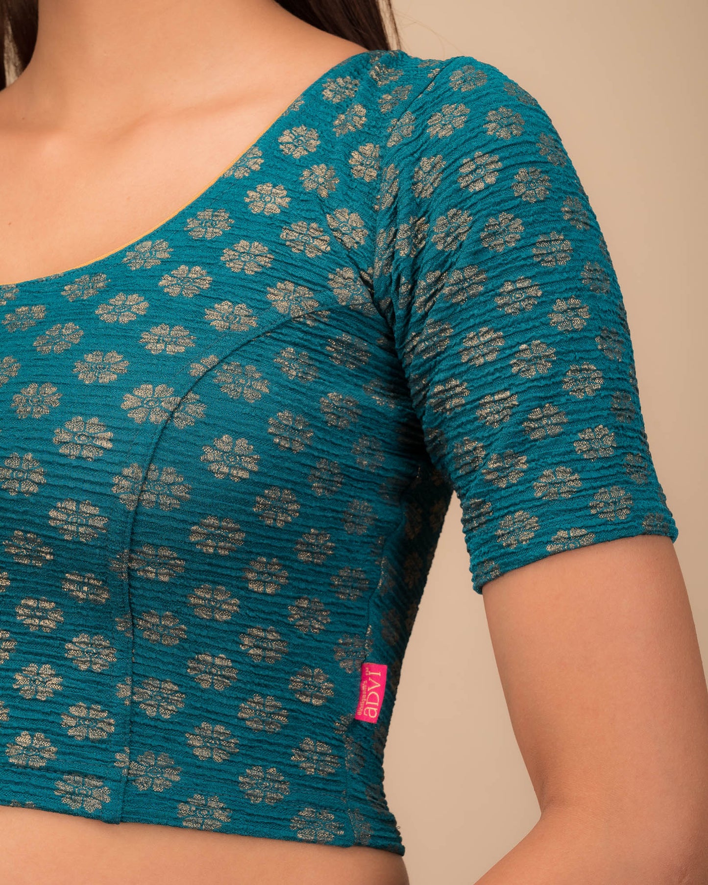 Close-up of jacquard knit with foil floral pattern.
