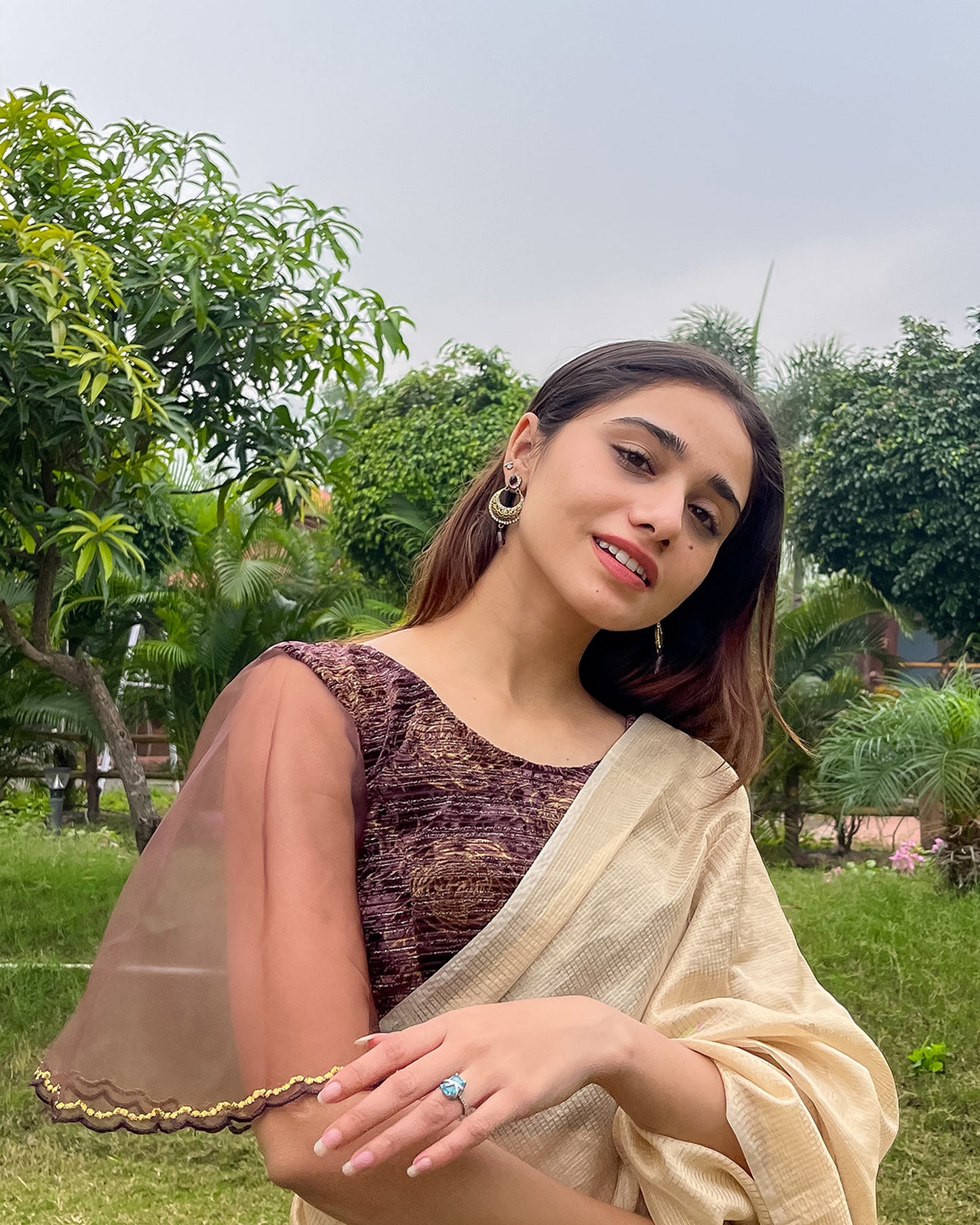 Model pairing the blouse with a saree, demonstrating a festive-ready look.