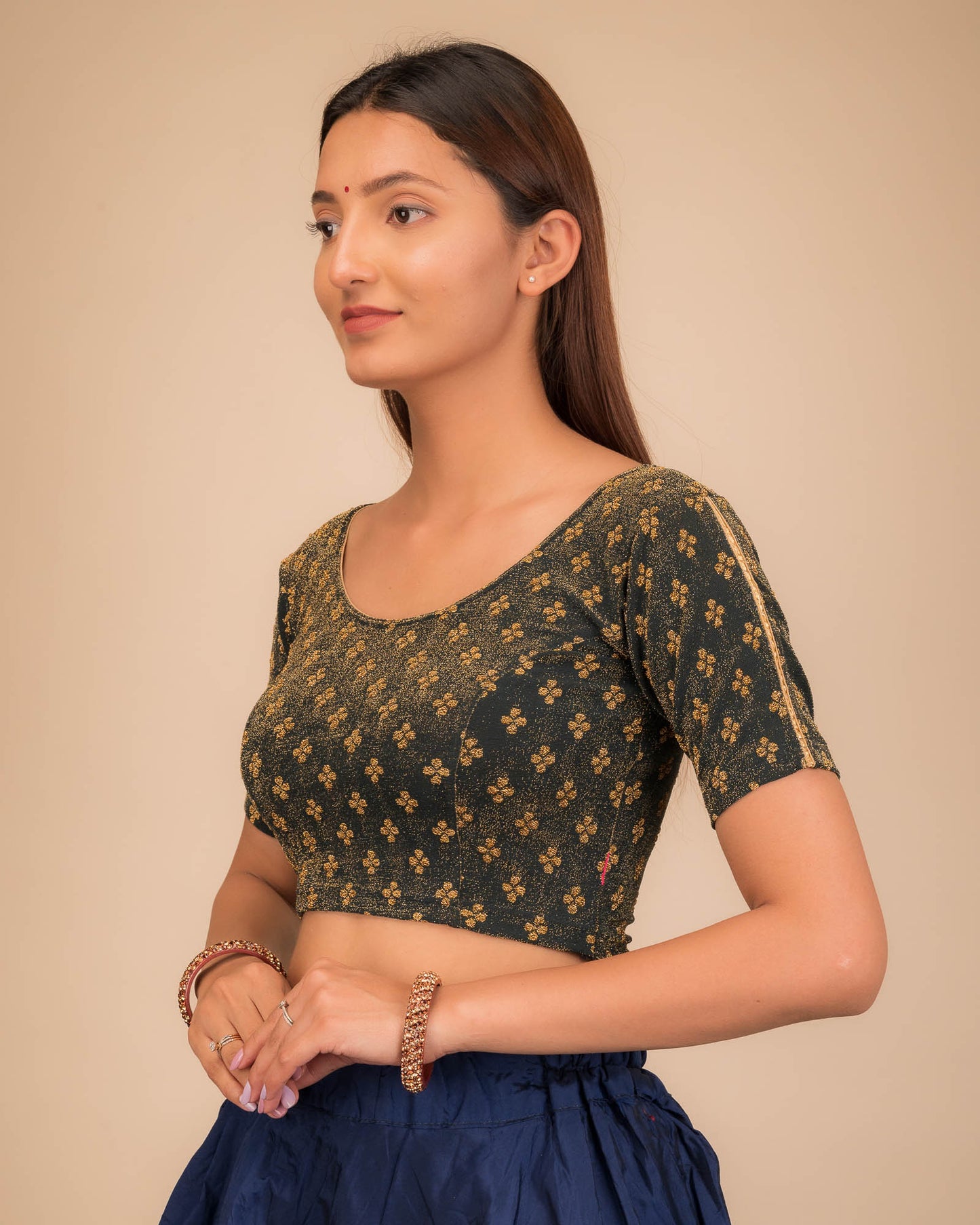 Side profile emphasizing the blouse’s fit and sleeve structure.