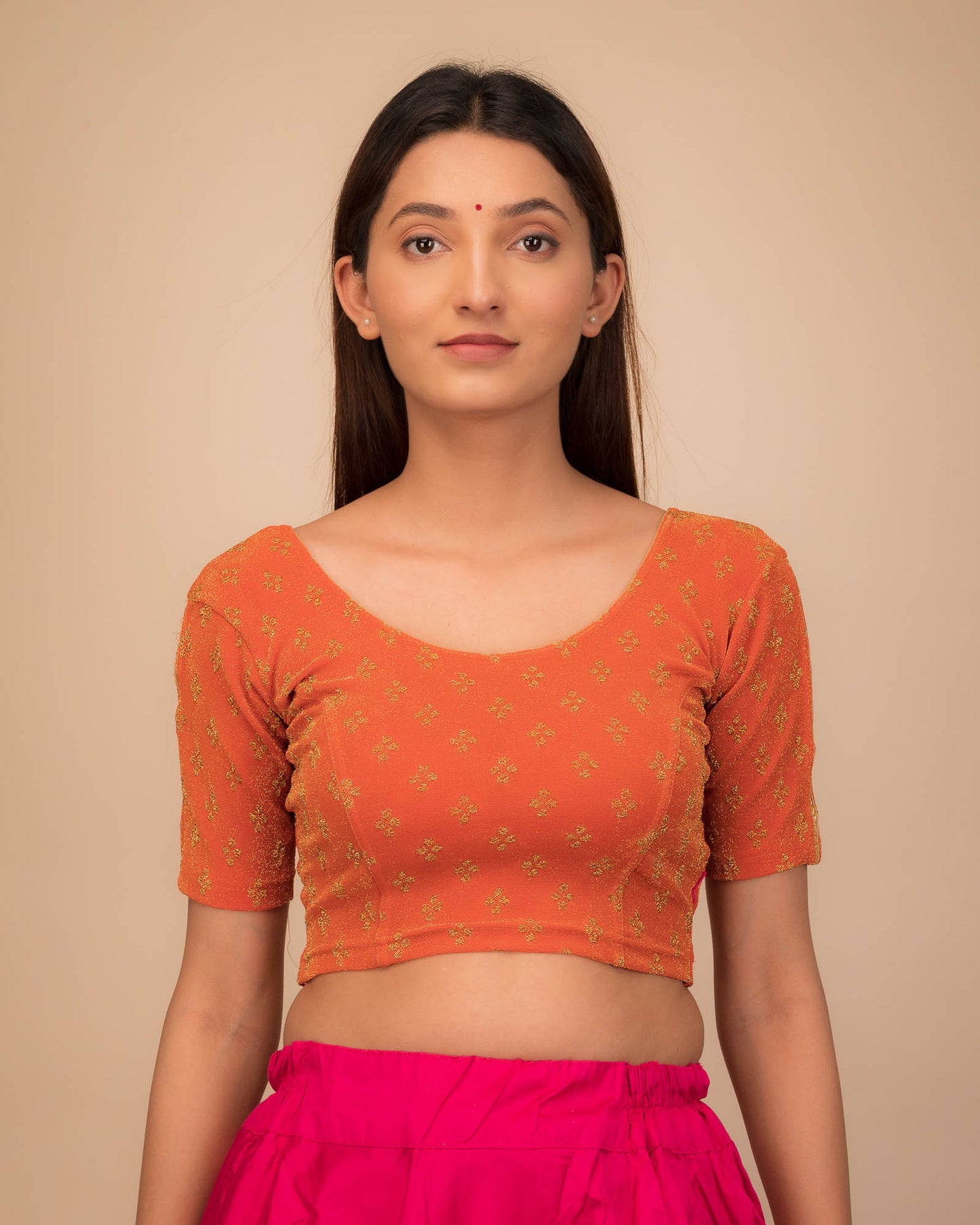 Model wearing a stretchable blouse with elbow sleeves and round neckline, showcasing buti motifs.