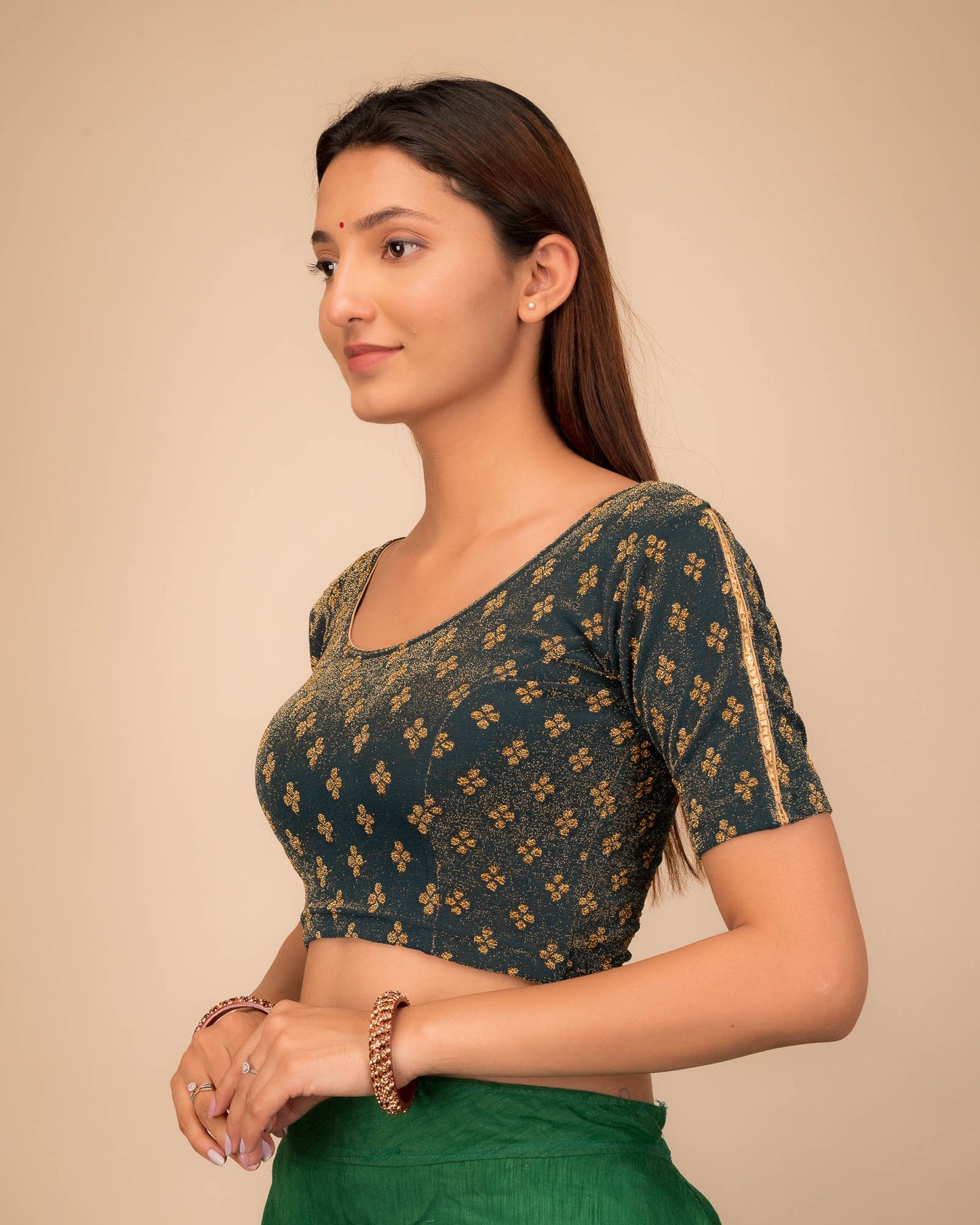 Side profile emphasizing the blouse’s fit and sleeve structure.