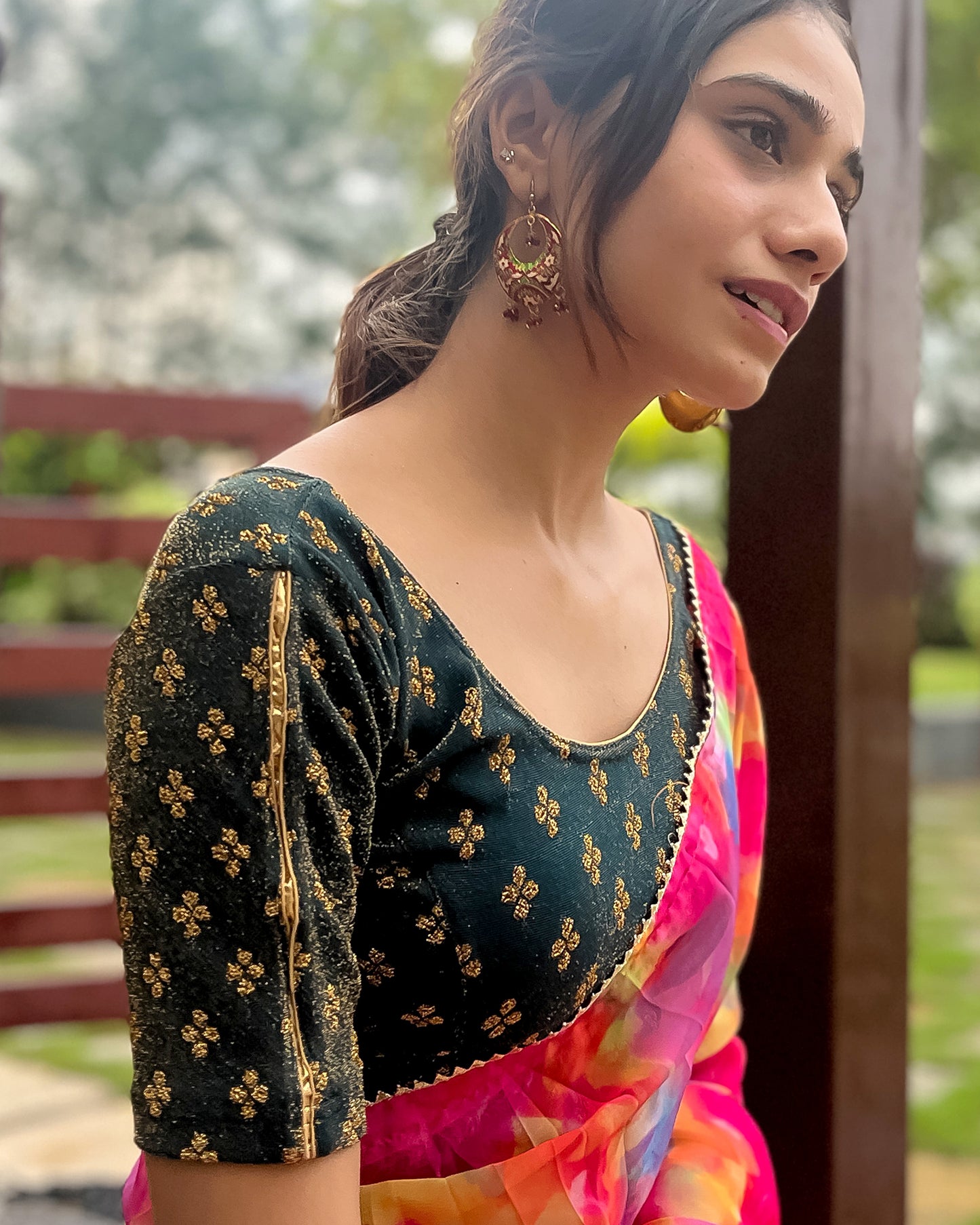Model pairing the blouse with a saree for a traditional look.