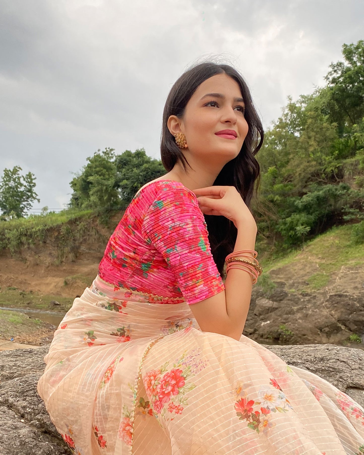 Model pairing the blouse with a saree for a festive-ready look.