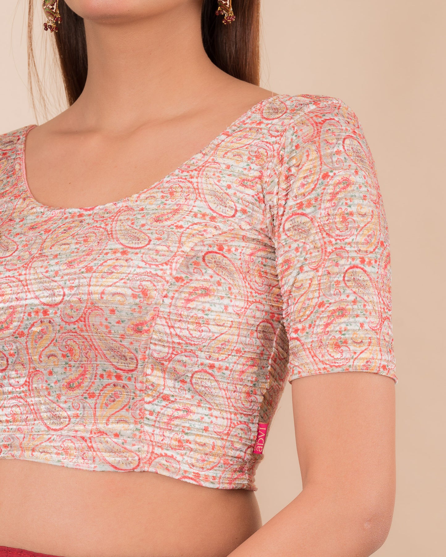 Close-up of the velvet fabric detailing the floral print texture.