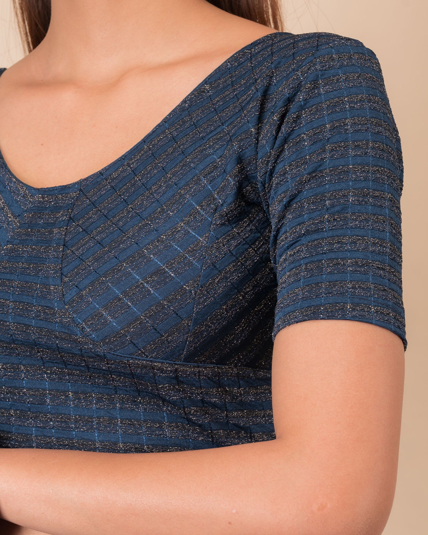Close-up of the zari stripe fabric detailing the texture and stretchability of the readymade blouse