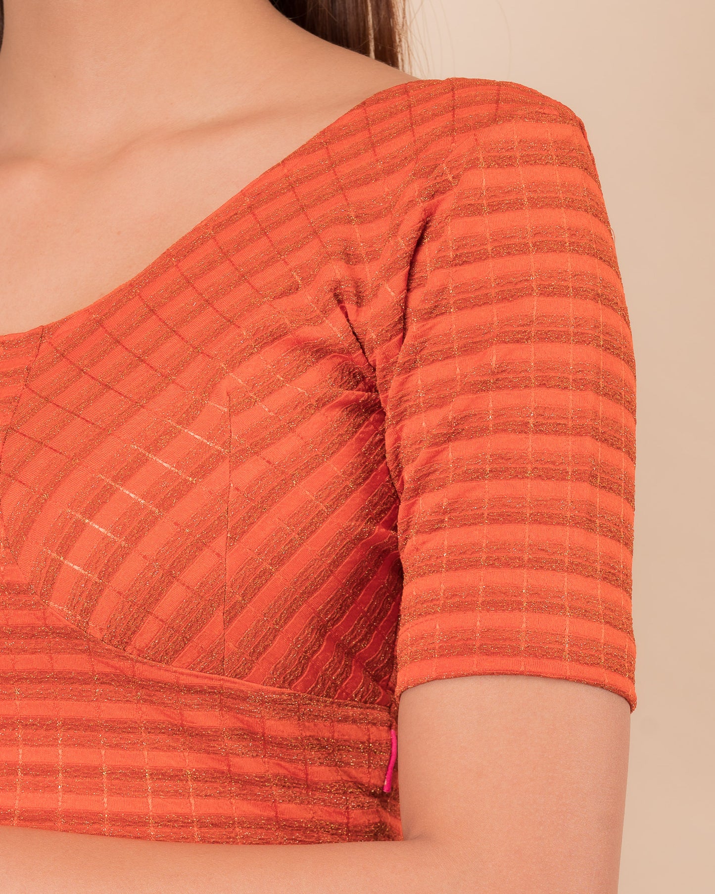 Close-up of the zari stripe fabric detailing the texture and stretchability of the readymade blouse