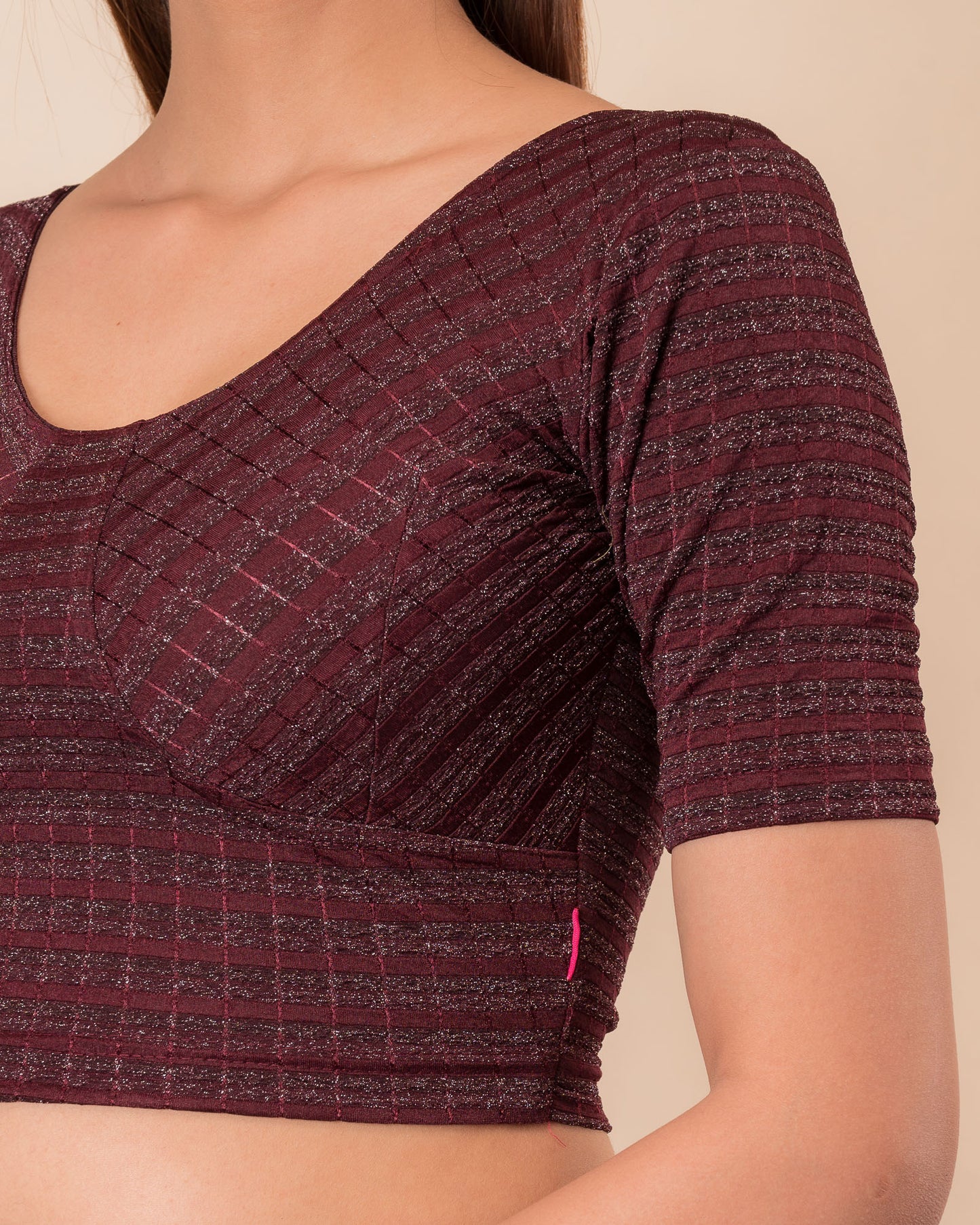 Close-up of the zari stripe fabric detailing the texture and stretchability of the readymade blouse