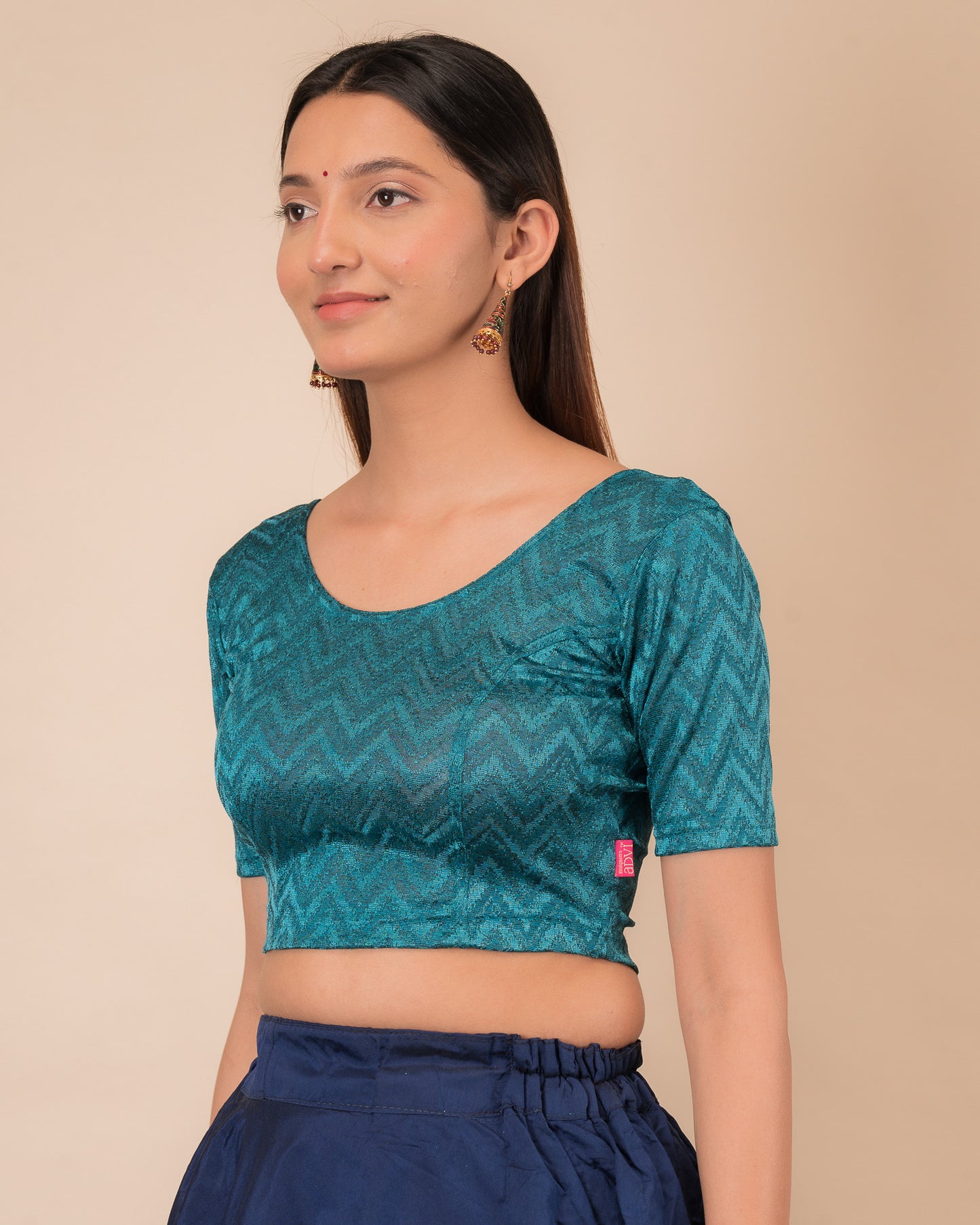 Side profile of the maroon melange zig-zag blouse highlighting the fit and sleeve length