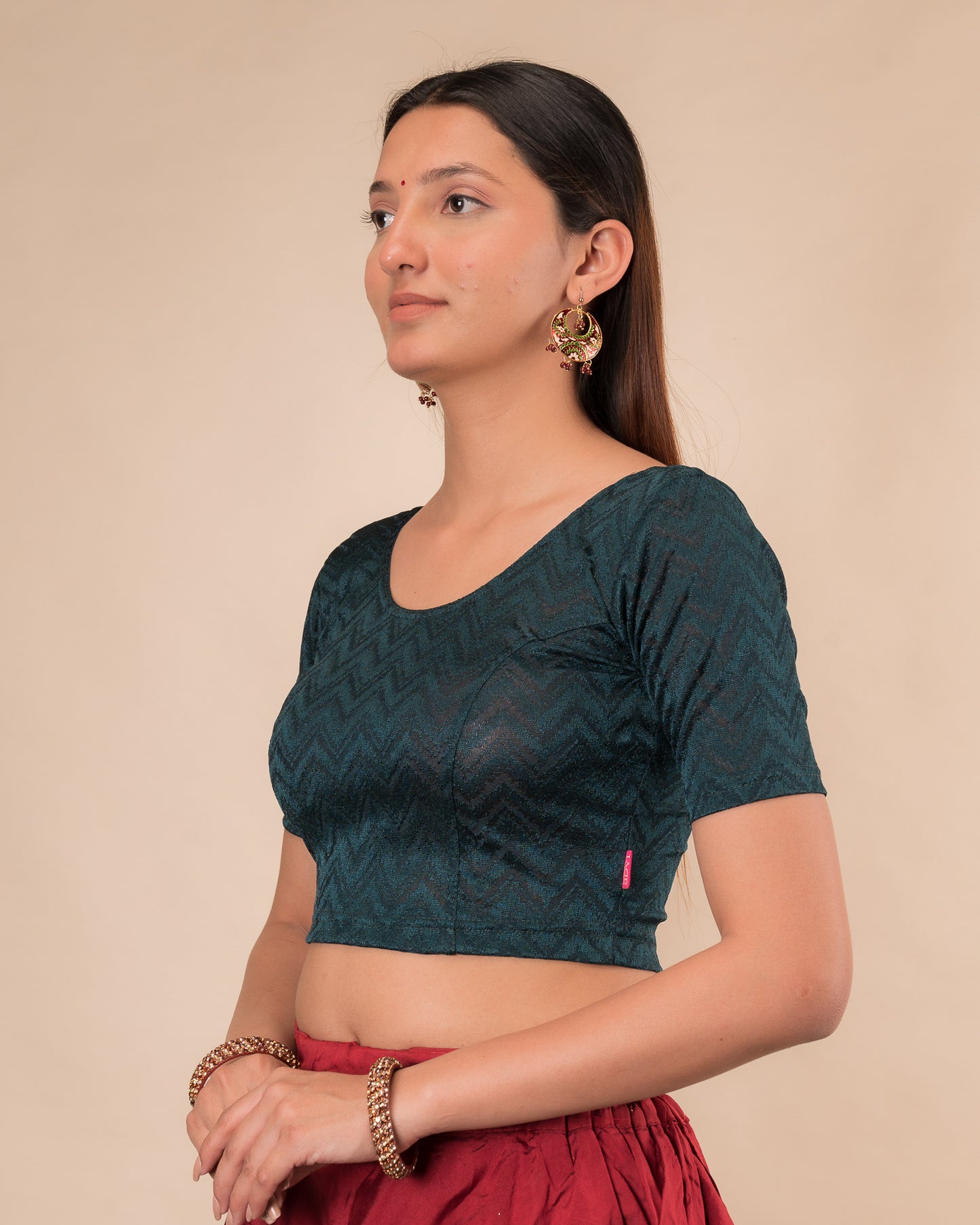 Side profile of the maroon melange zig-zag blouse highlighting the fit and sleeve length