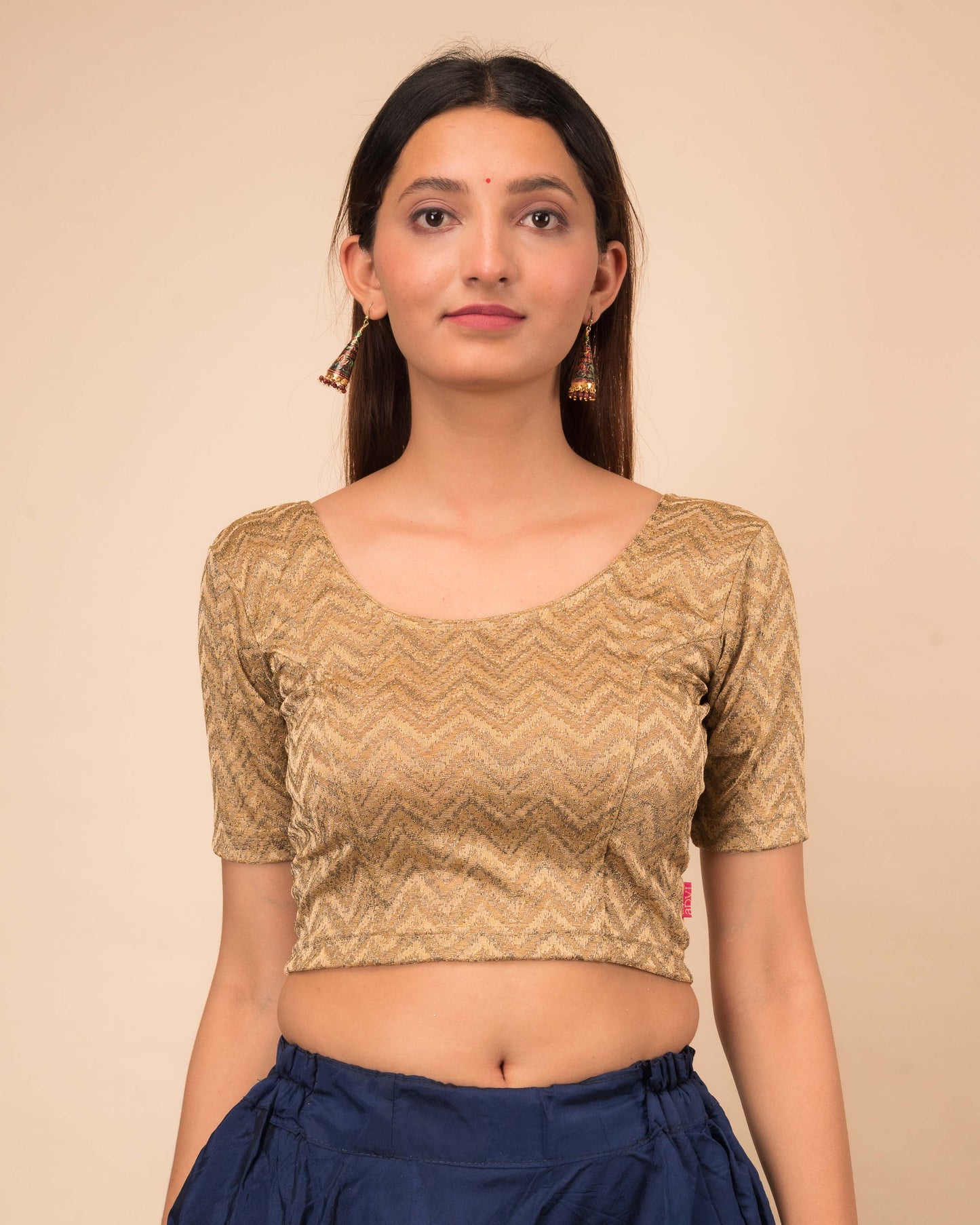 Model wearing a maroon melange zig-zag patterned stretchable readymade blouse with elbow sleeves and round neckline