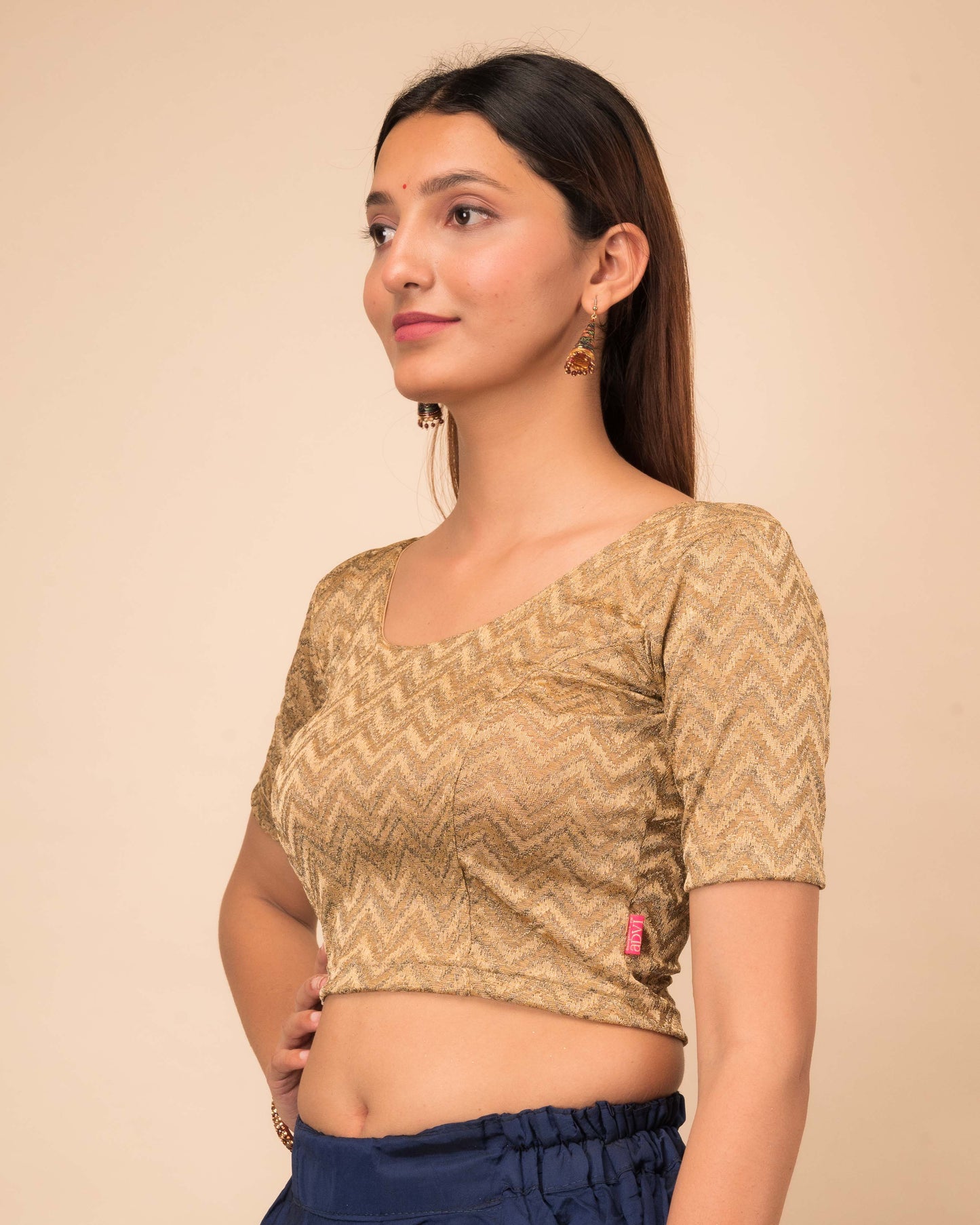 Side profile of the maroon melange zig-zag blouse highlighting the fit and sleeve length