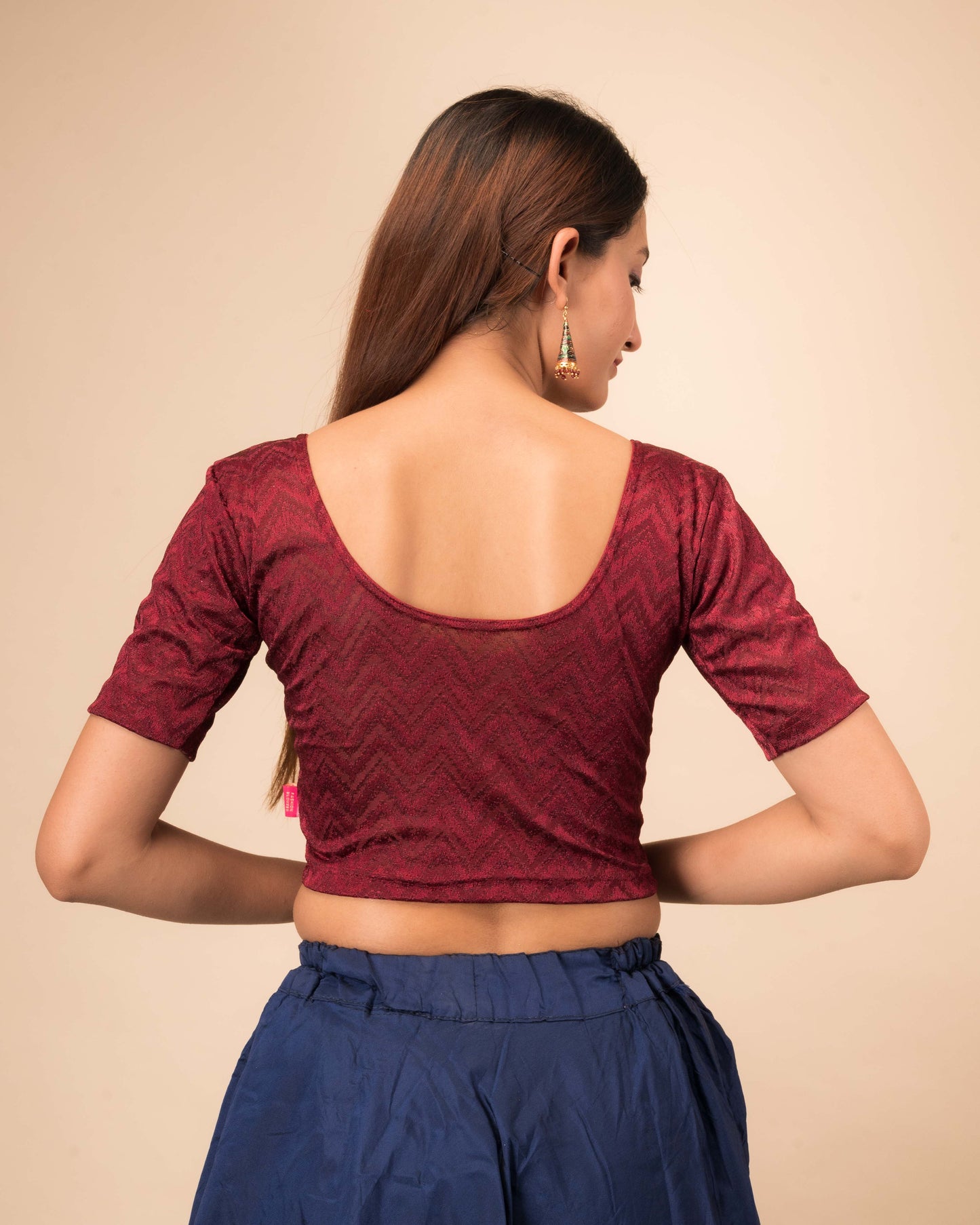 Rear view of the maroon melange zig-zag blouse showcasing the back design