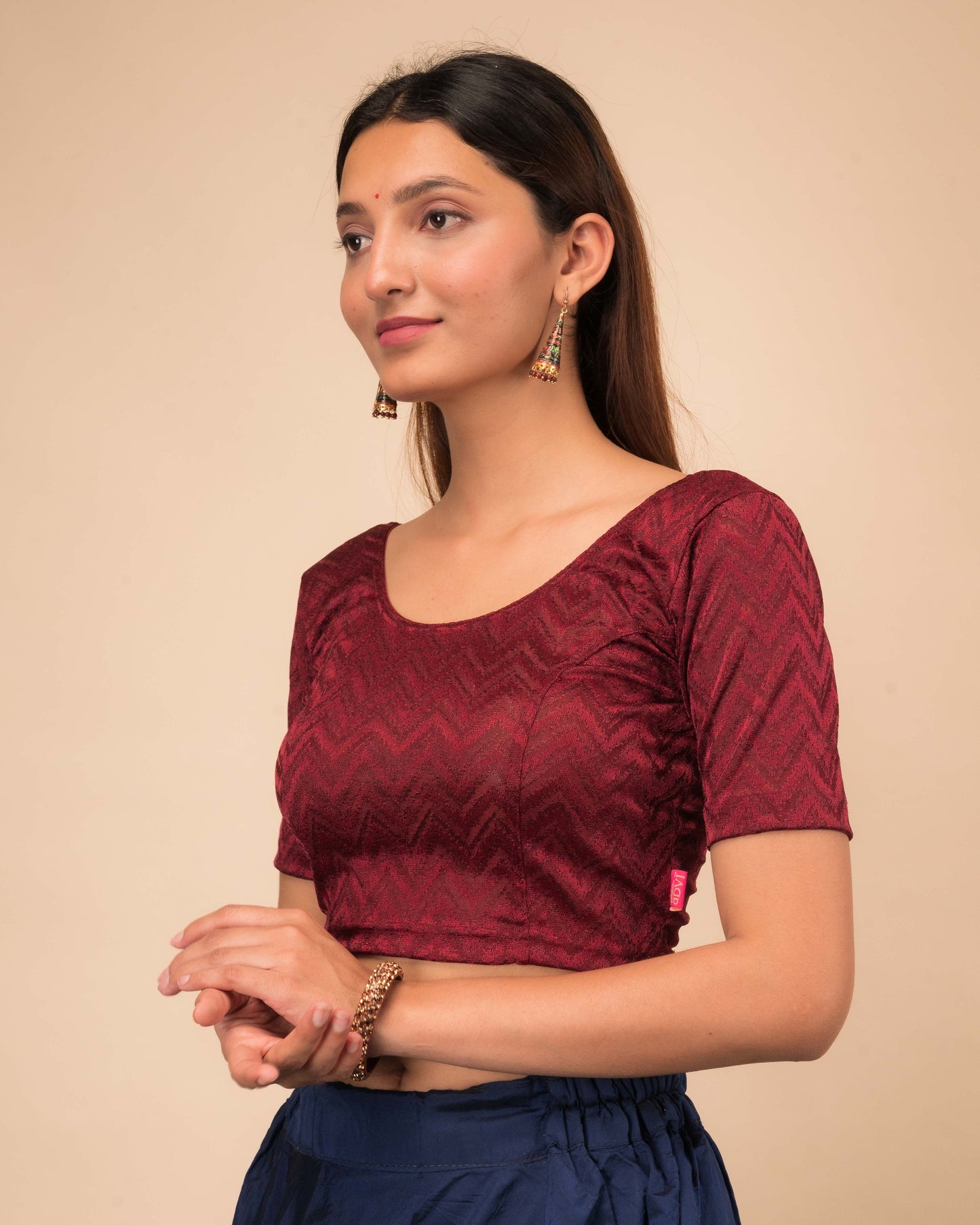 Side profile of the maroon melange zig-zag blouse highlighting the fit and sleeve length