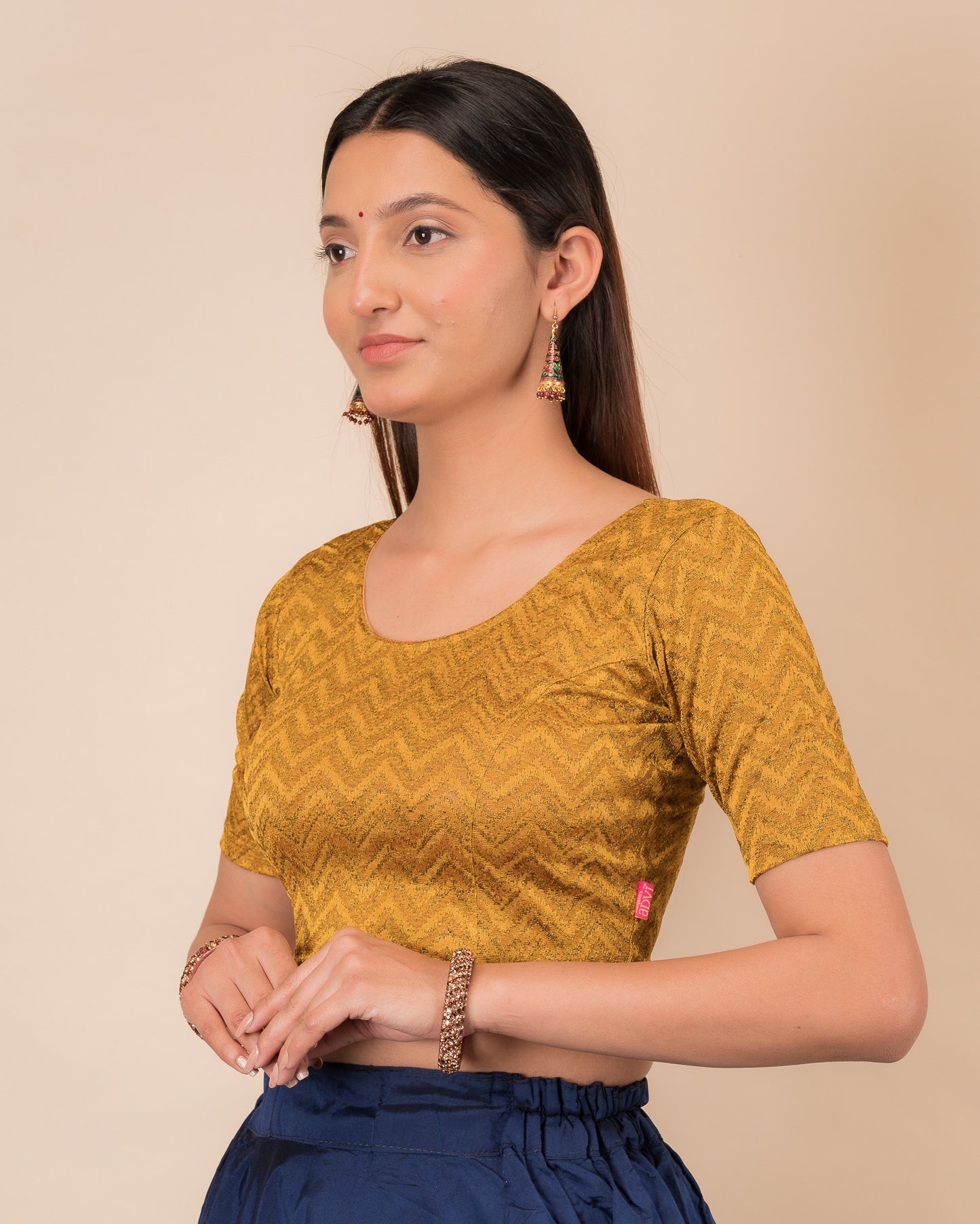 Side profile of the maroon melange zig-zag blouse highlighting the fit and sleeve length