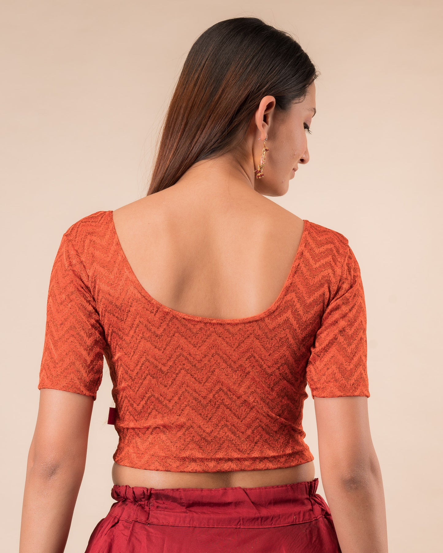 Rear view of the maroon melange zig-zag blouse showcasing the back design