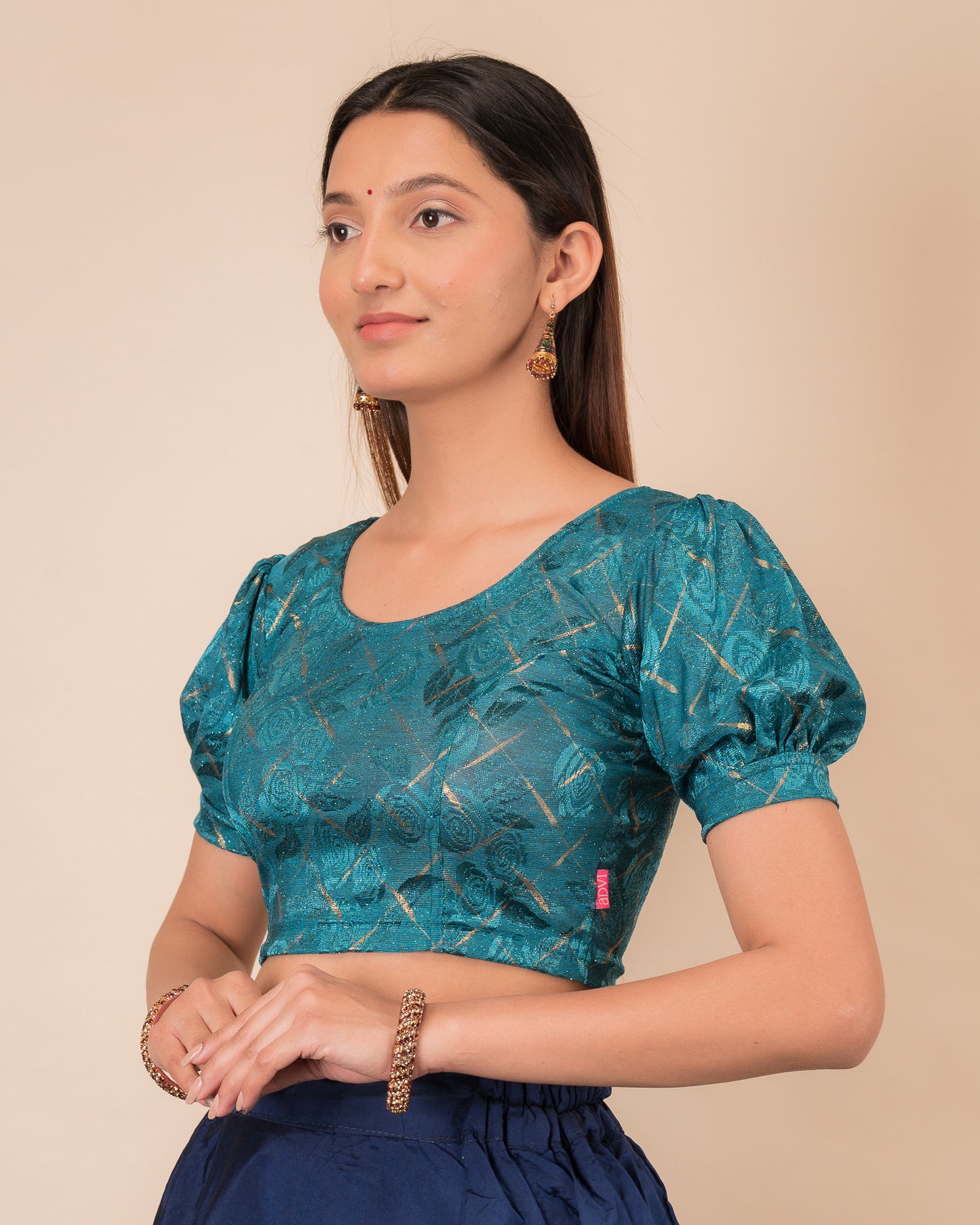 Side profile of the grey melange stretchable blouse highlighting the fit and sleeve length