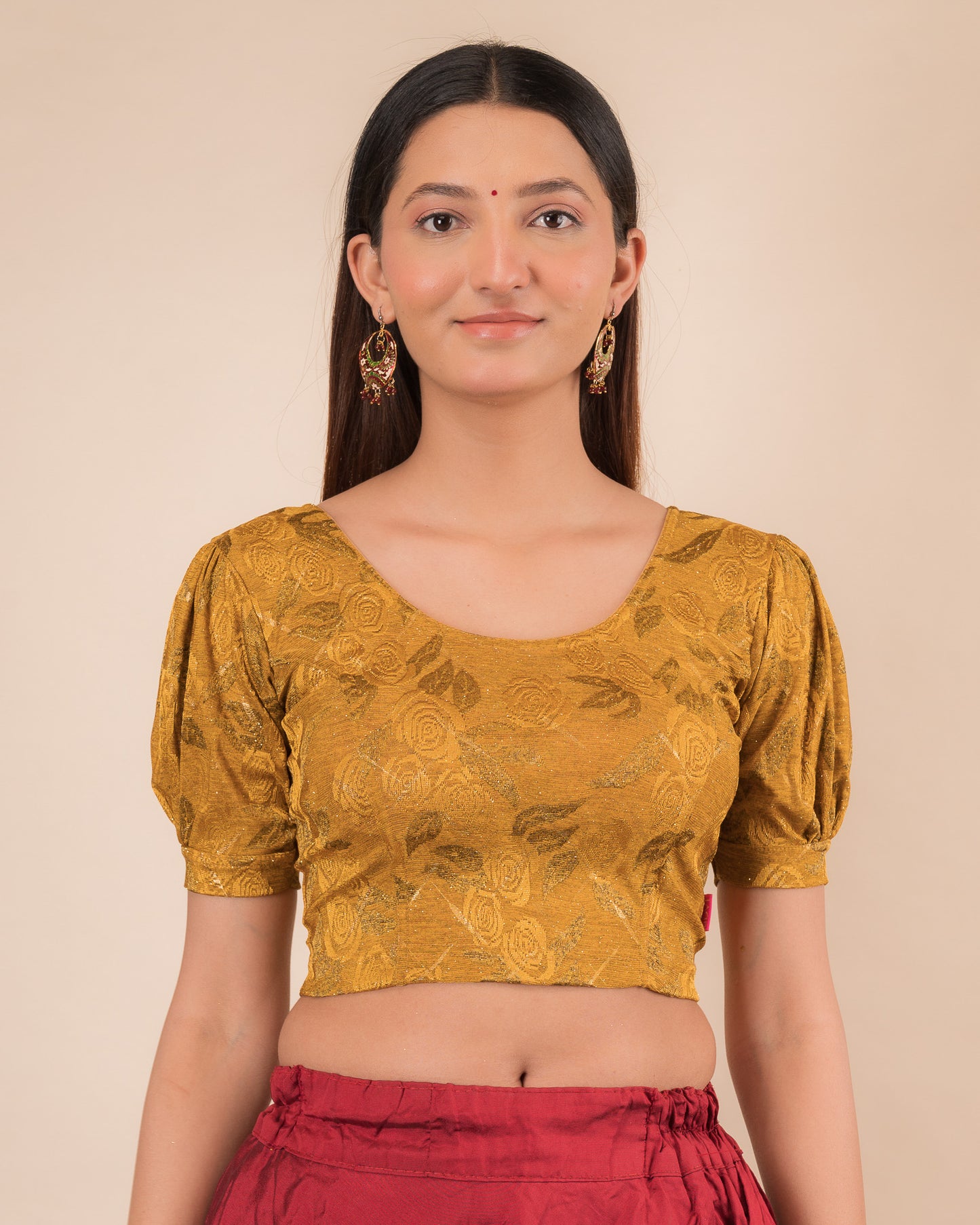 Model wearing a grey melange stretchable readymade blouse with puffed elbow sleeves and round neckline