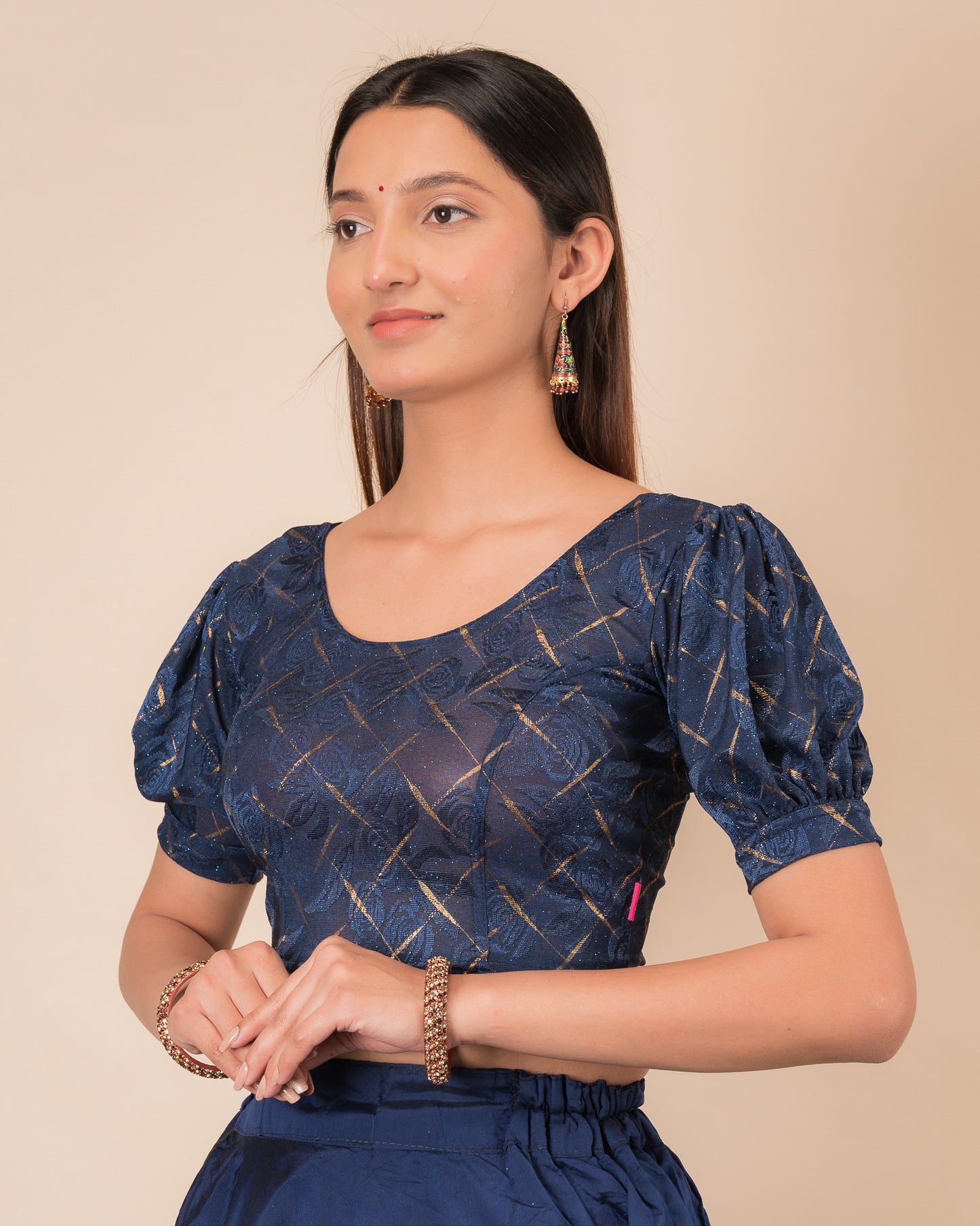 Side profile of the grey melange stretchable blouse highlighting the fit and sleeve length