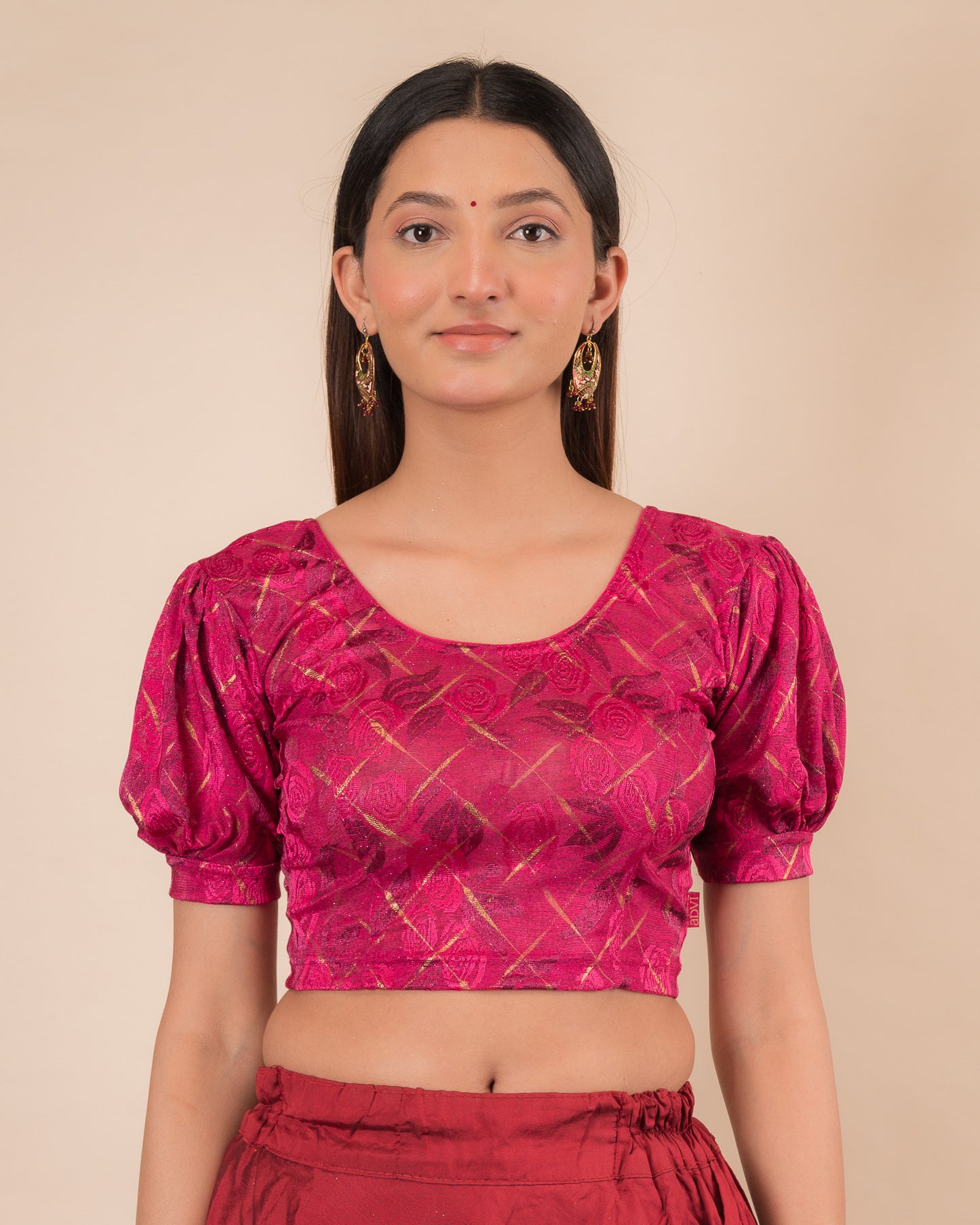 Model wearing a grey melange stretchable readymade blouse with puffed elbow sleeves and round neckline