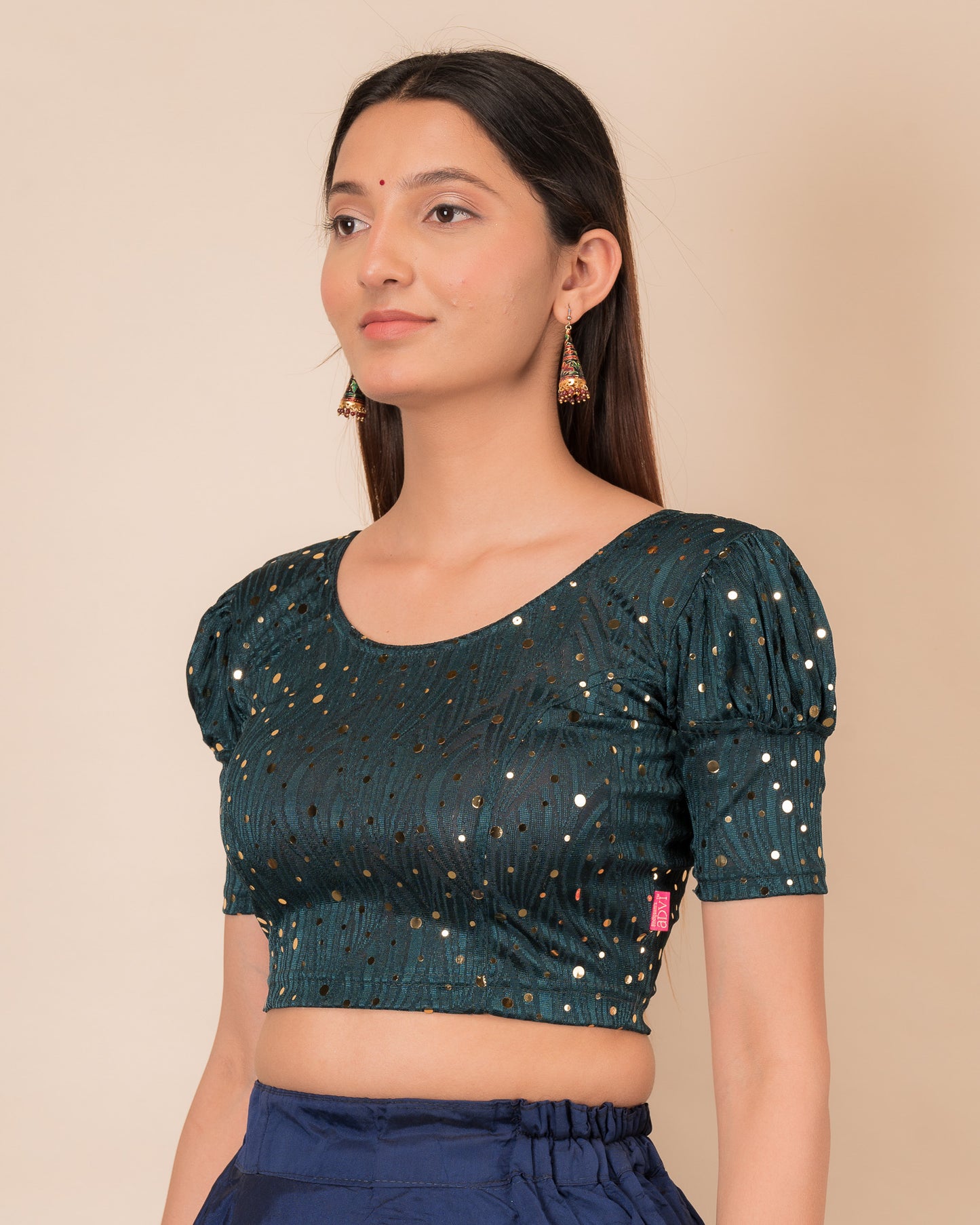 Side profile highlighting the fit and puffed sleeve silhouette