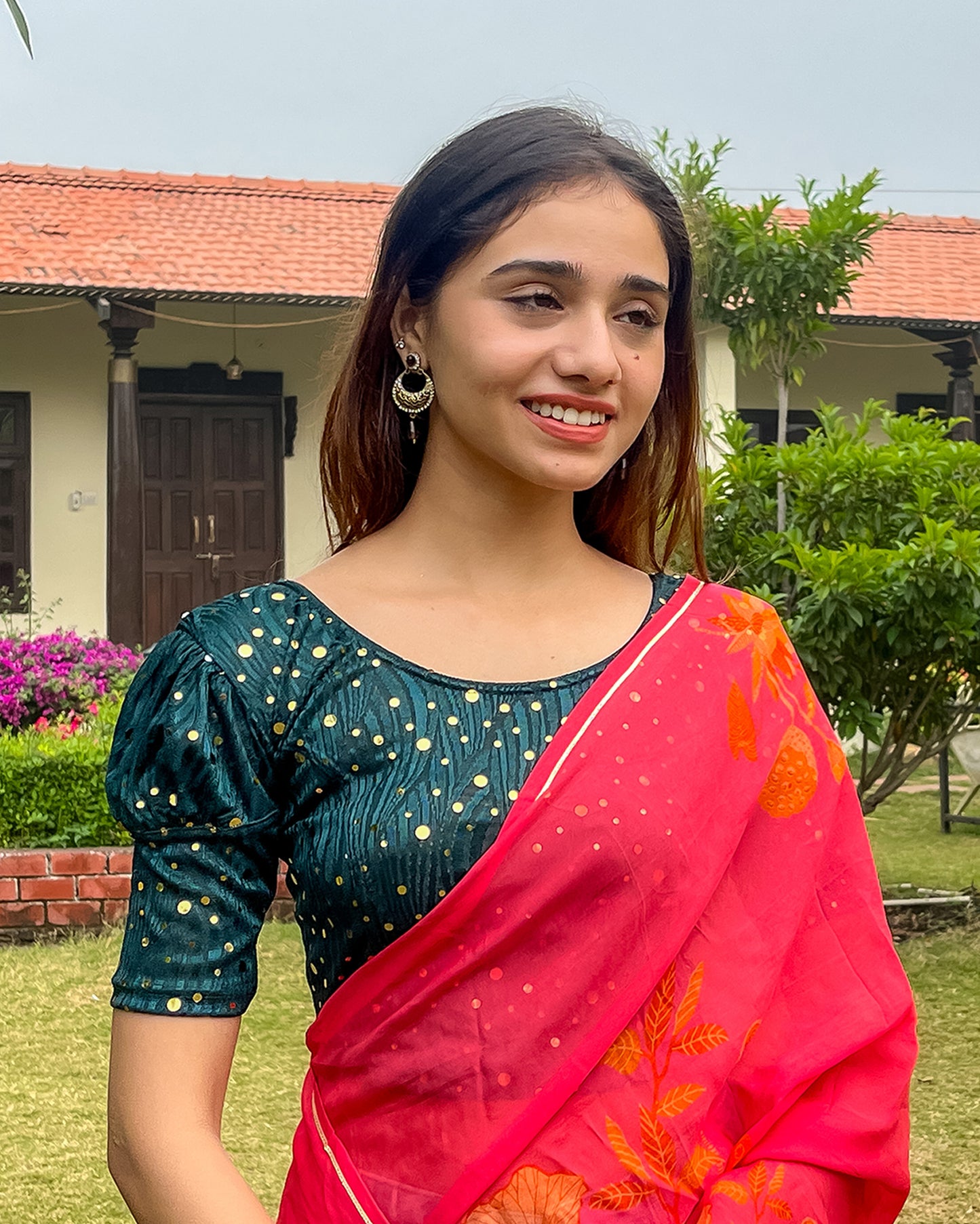 Model pairing the blouse with a saree for a festive occasion.