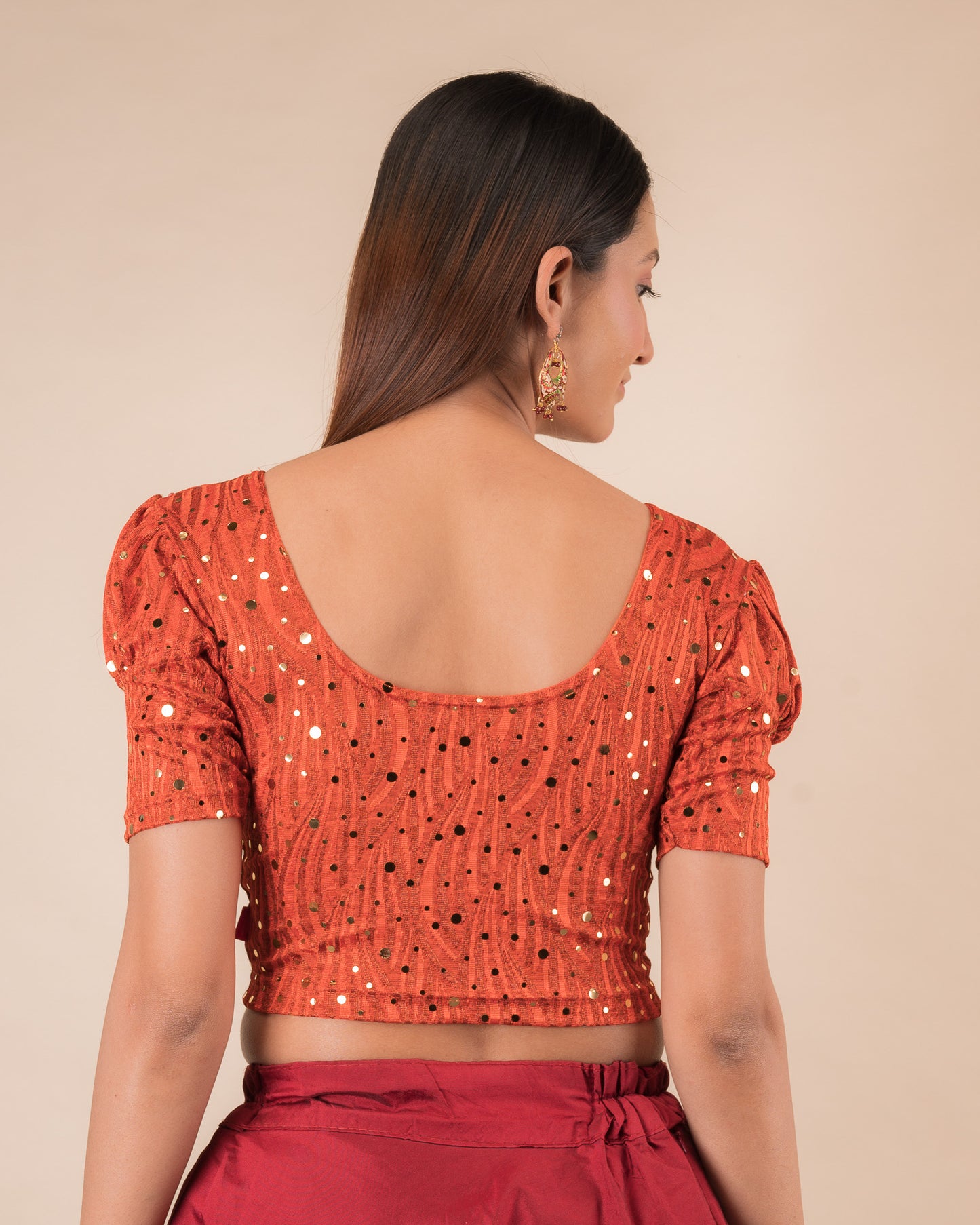 Rear view showing the round back design and mirror work