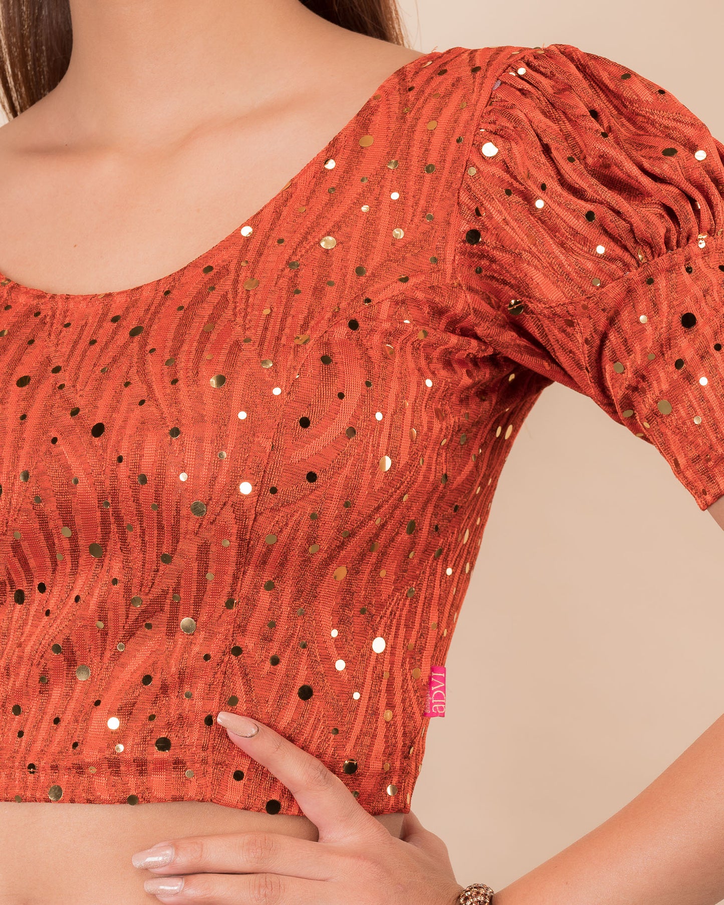 Close-up showing mirror embellishments on the jacquard stretchable fabric