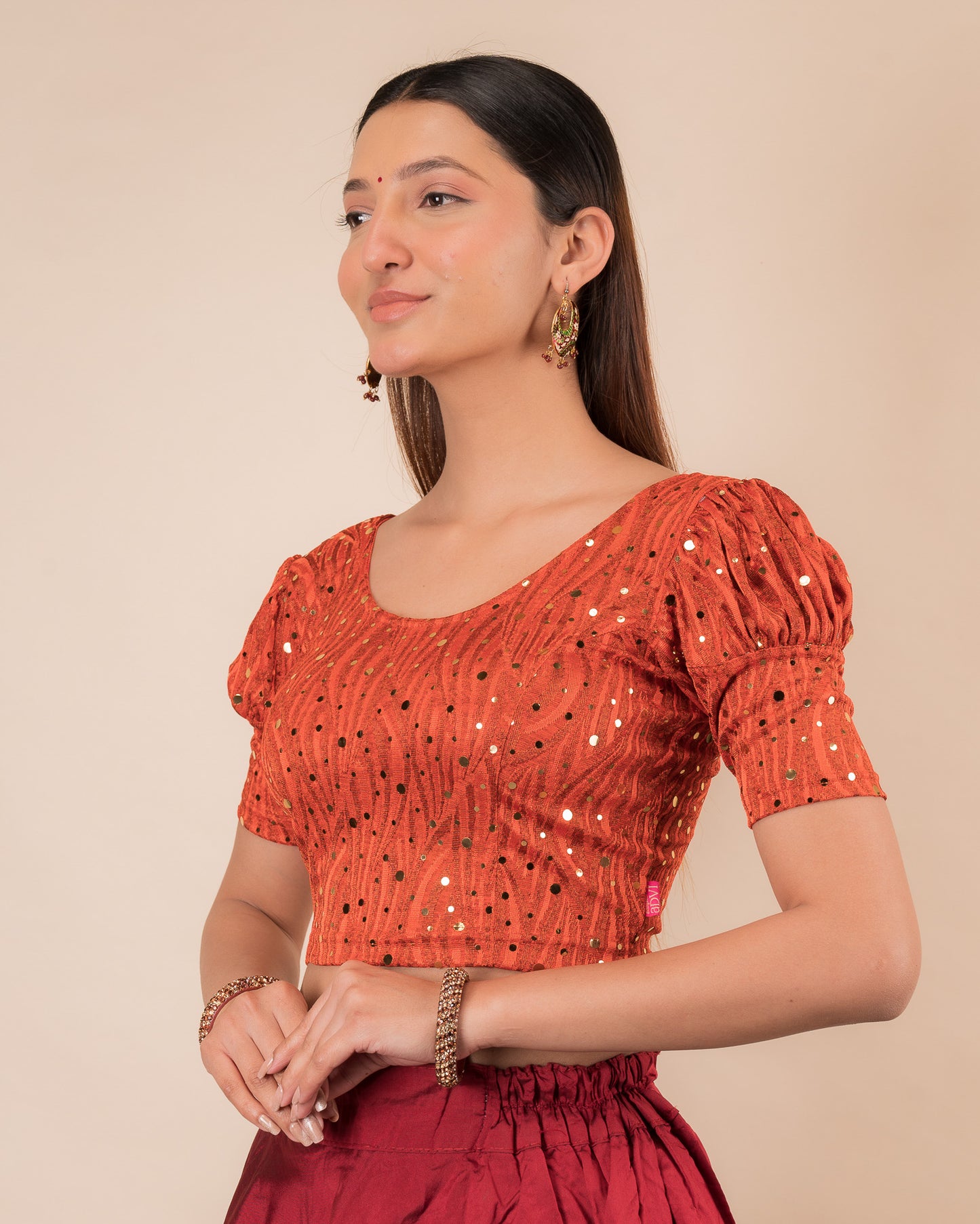 Side profile highlighting the fit and puffed sleeve silhouette