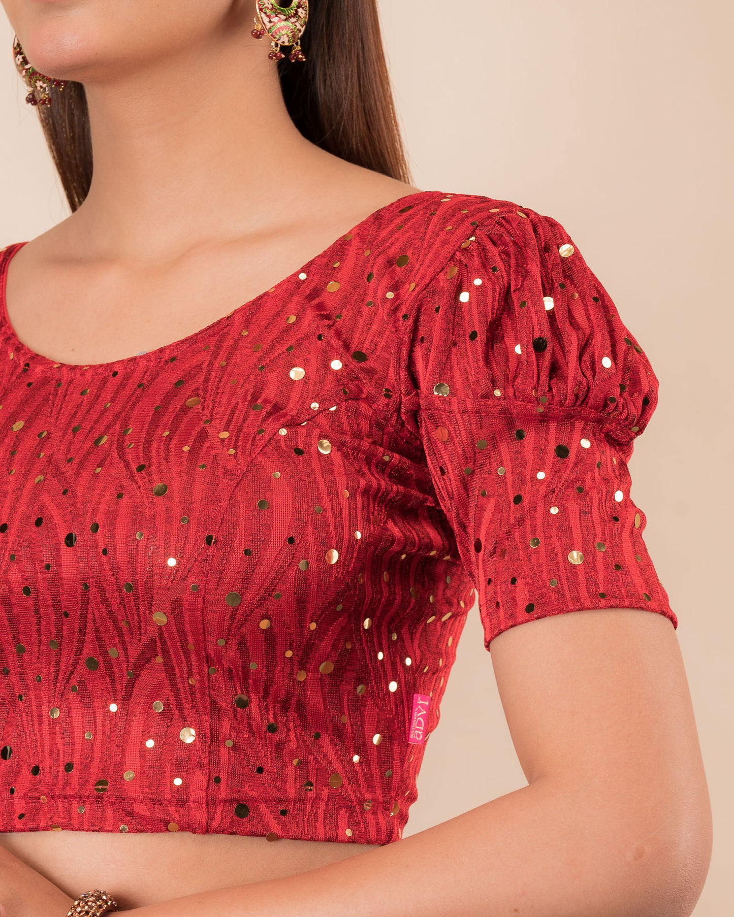 Close-up showing mirror embellishments on the jacquard stretchable fabric