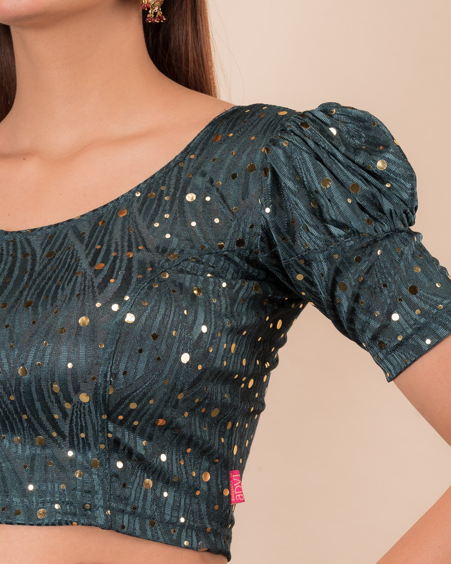 Close-up showing mirror embellishments on the jacquard stretchable fabric