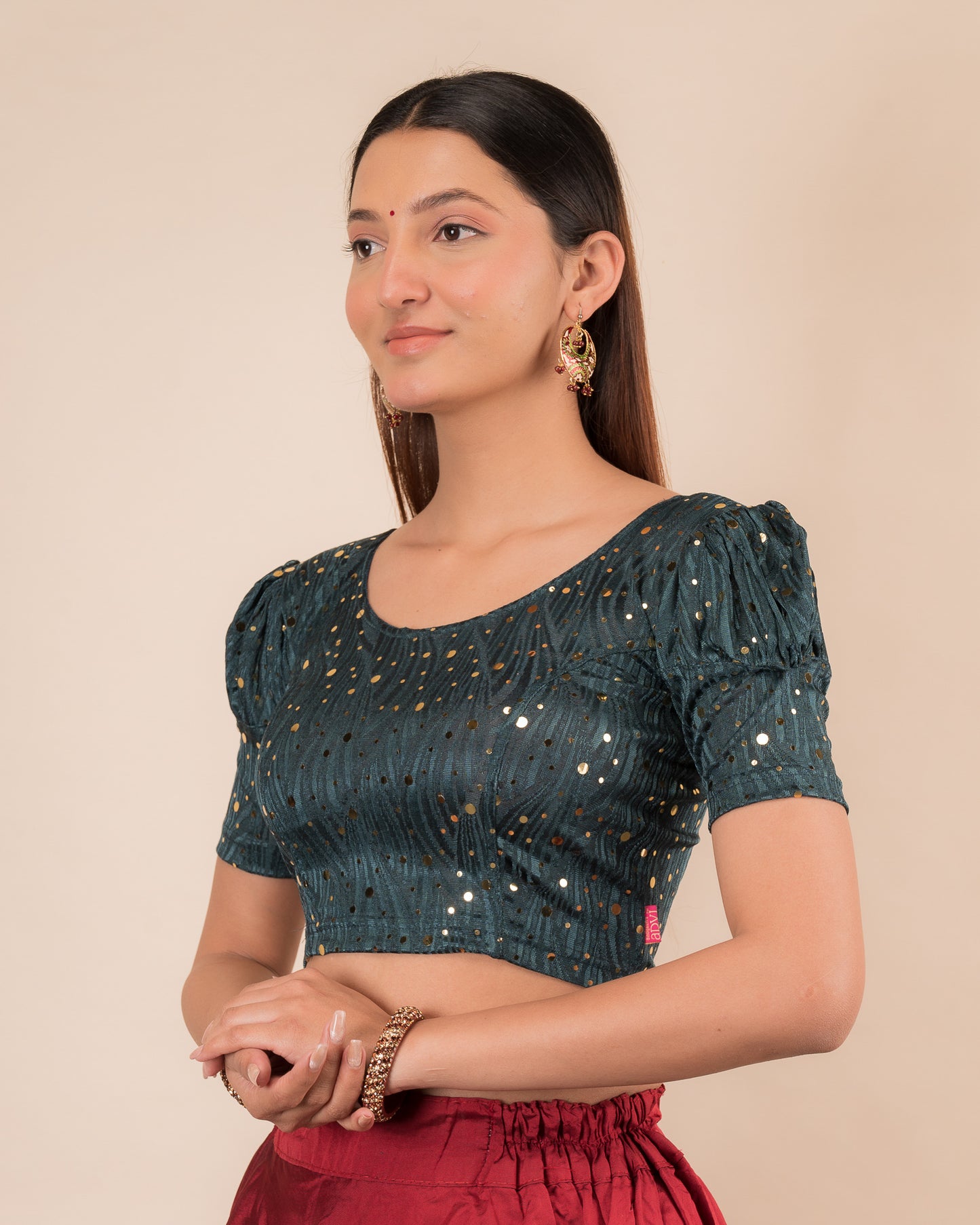 Side profile highlighting the fit and puffed sleeve silhouette