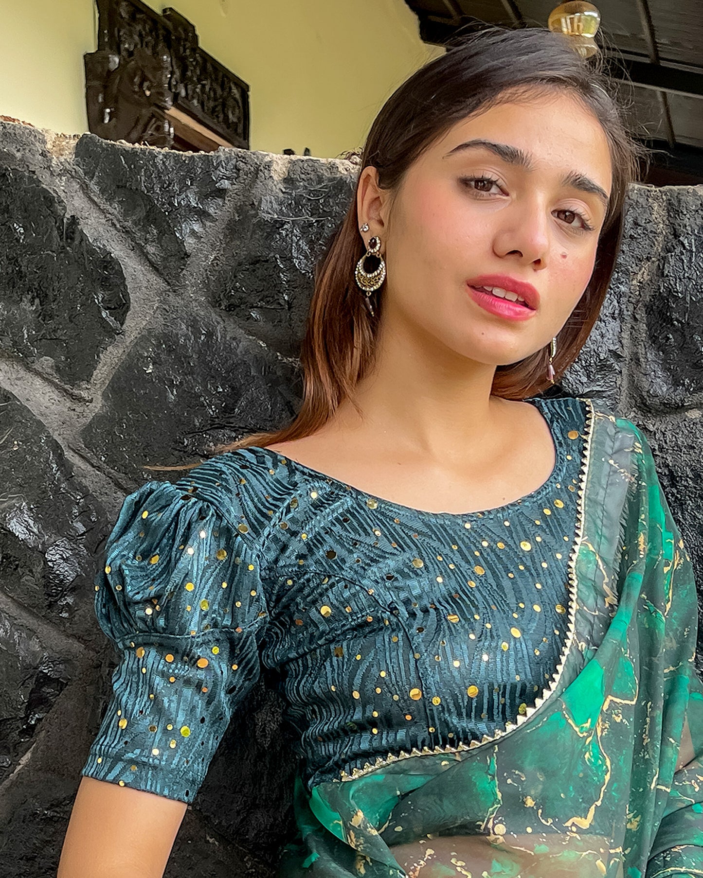 Model pairing the blouse with a saree for a festive occasion