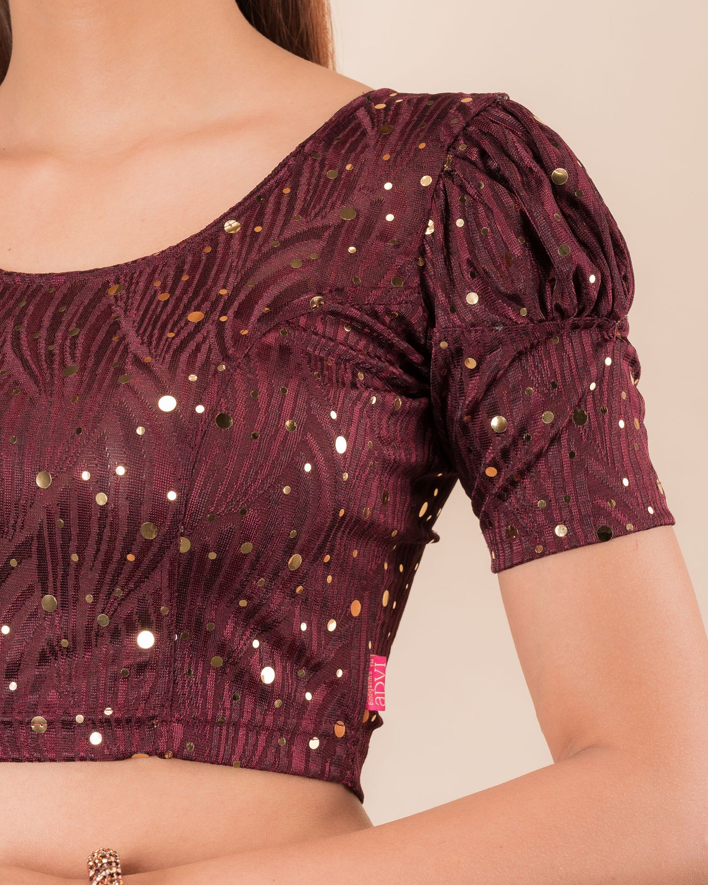 Close-up showing mirror embellishments on the jacquard stretchable fabric