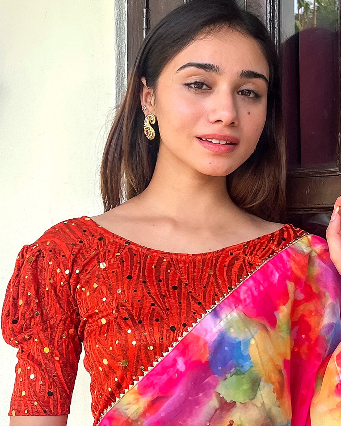 Model pairing the blouse with a saree for a festive occasion