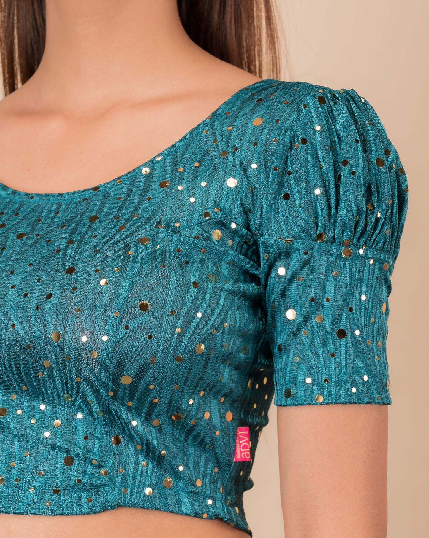 Close-up showing mirror embellishments on the jacquard stretchable fabric