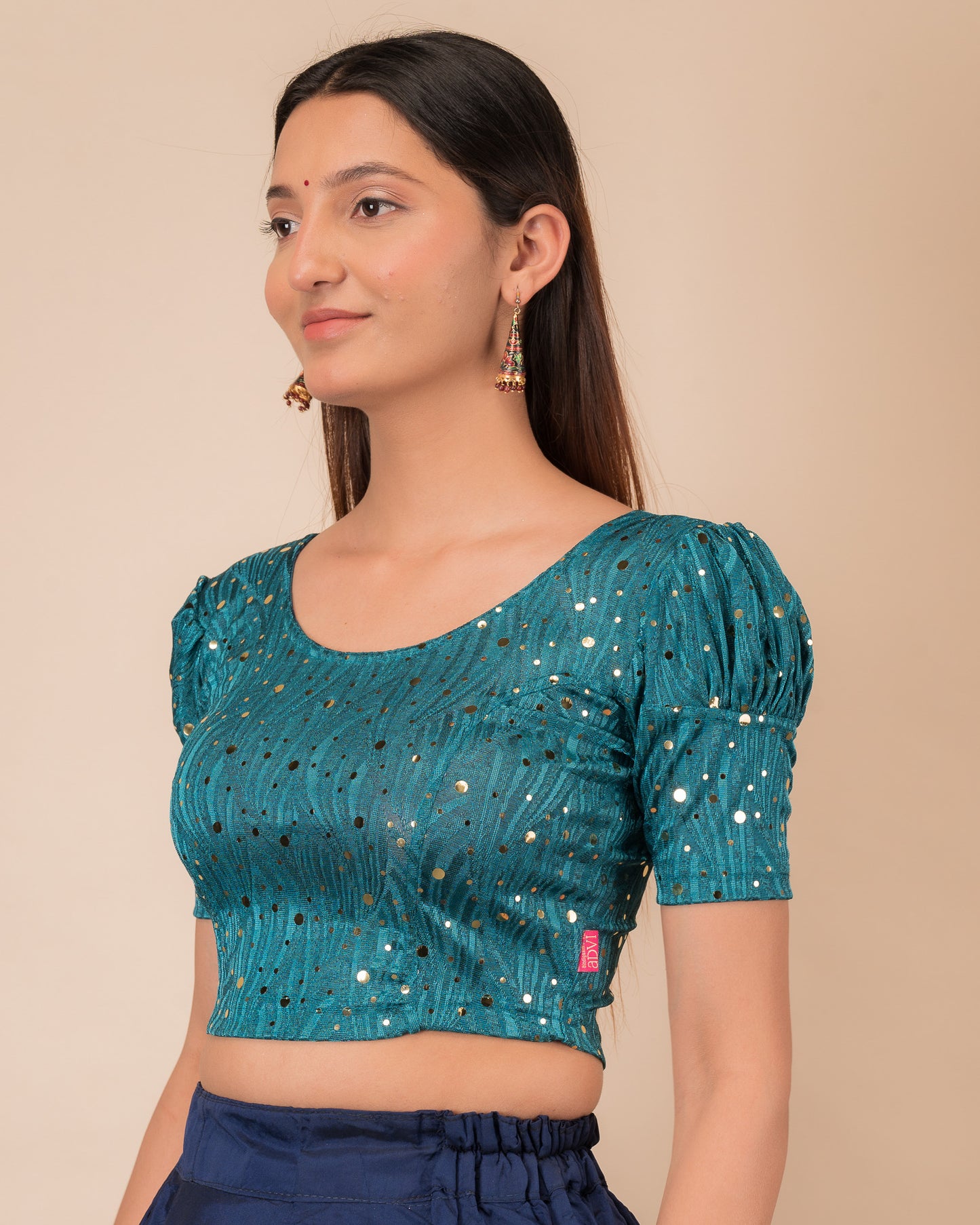 Side profile highlighting the fit and puffed sleeve silhouette