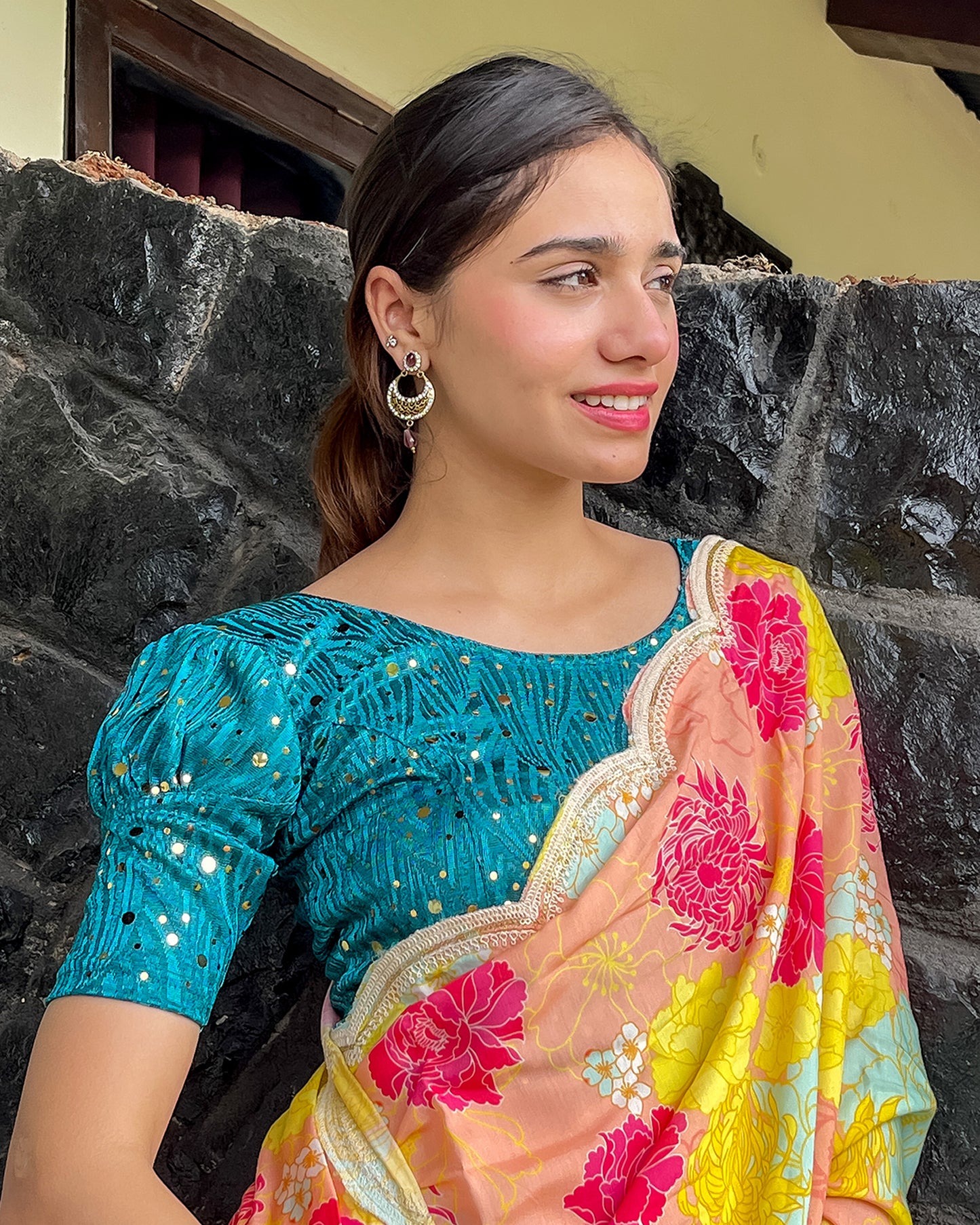 Model pairing the blouse with a saree for a festive occasion