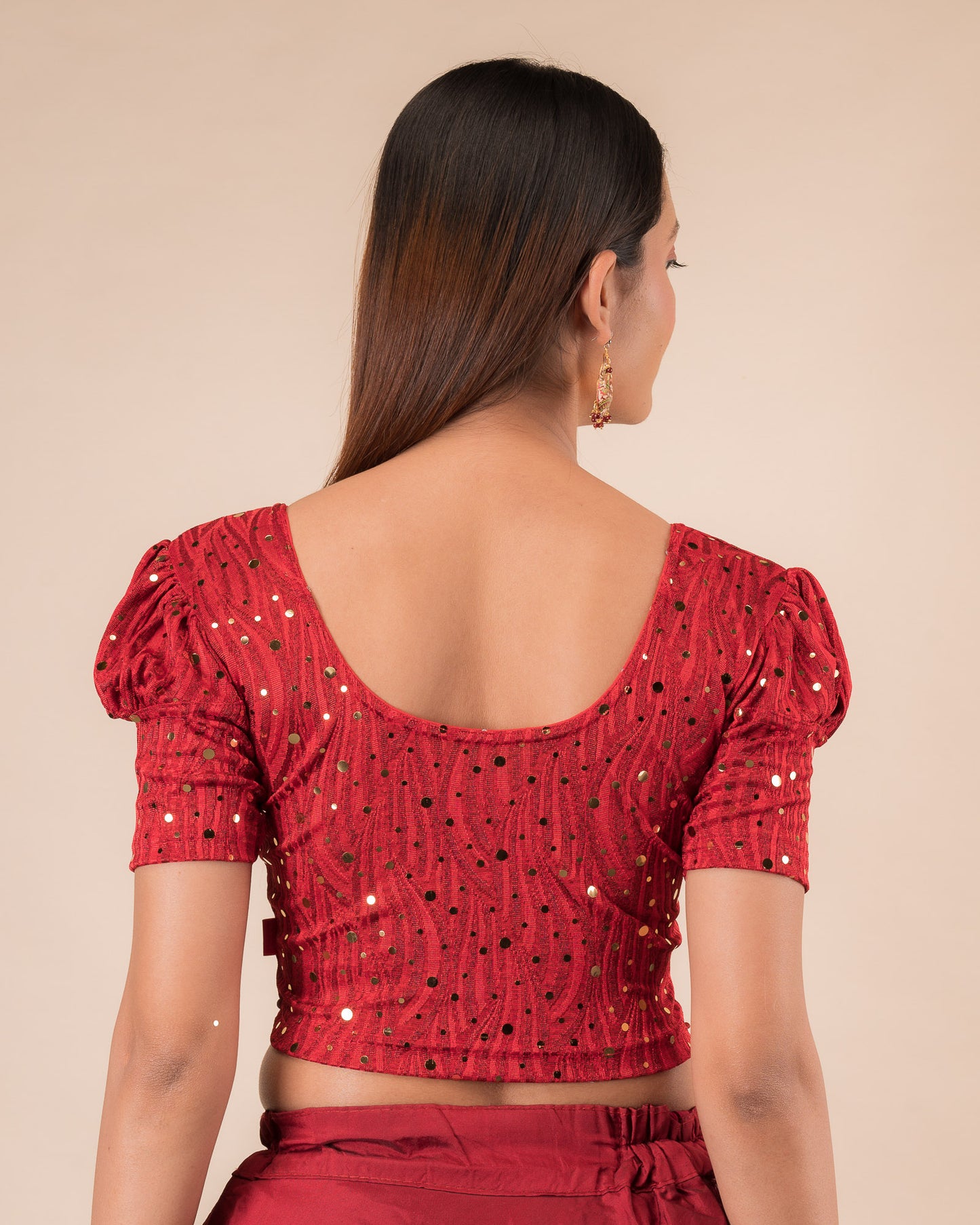 Rear view showing the round back design and mirror work.