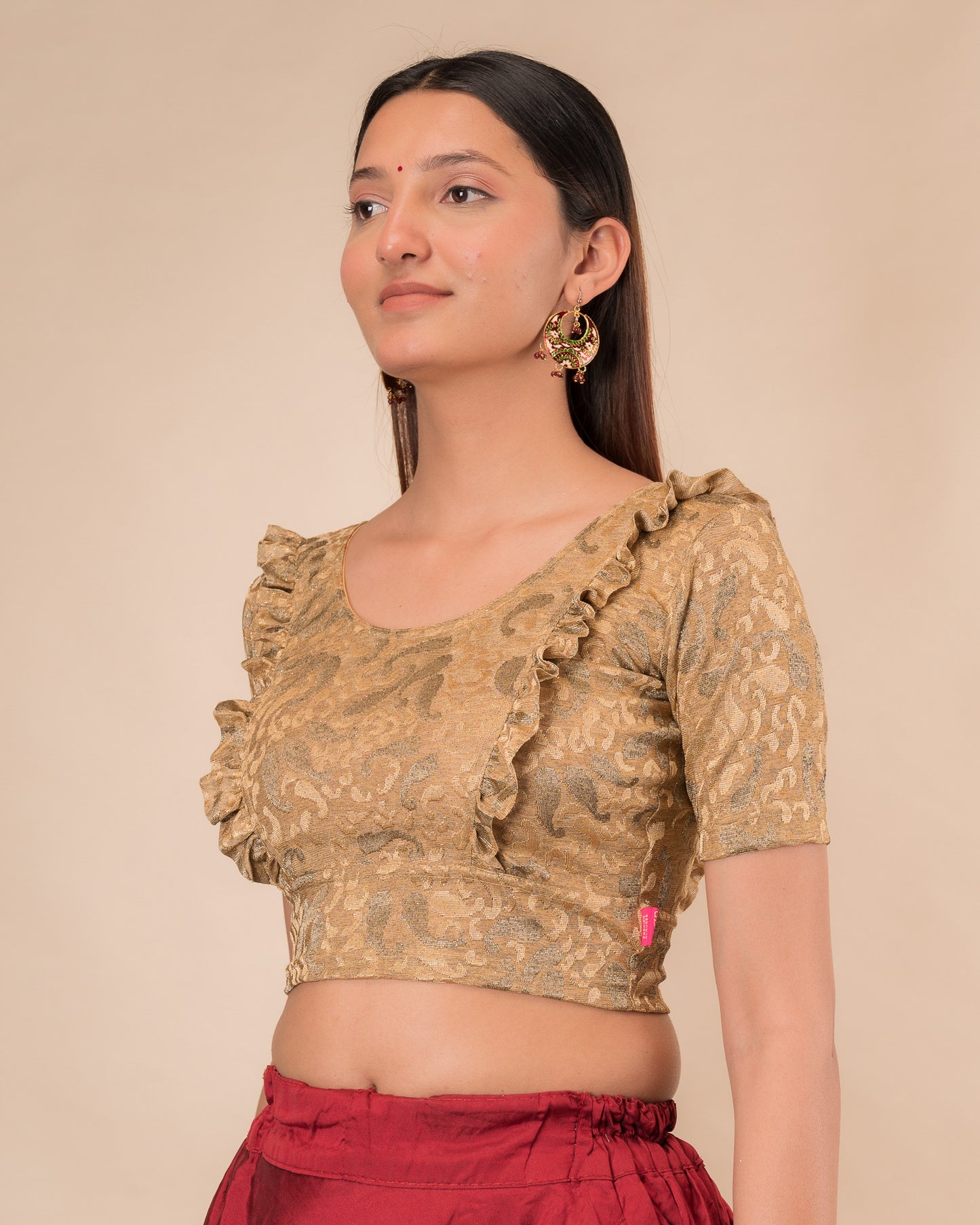 Side view highlighting the fit and shoulder ruffles