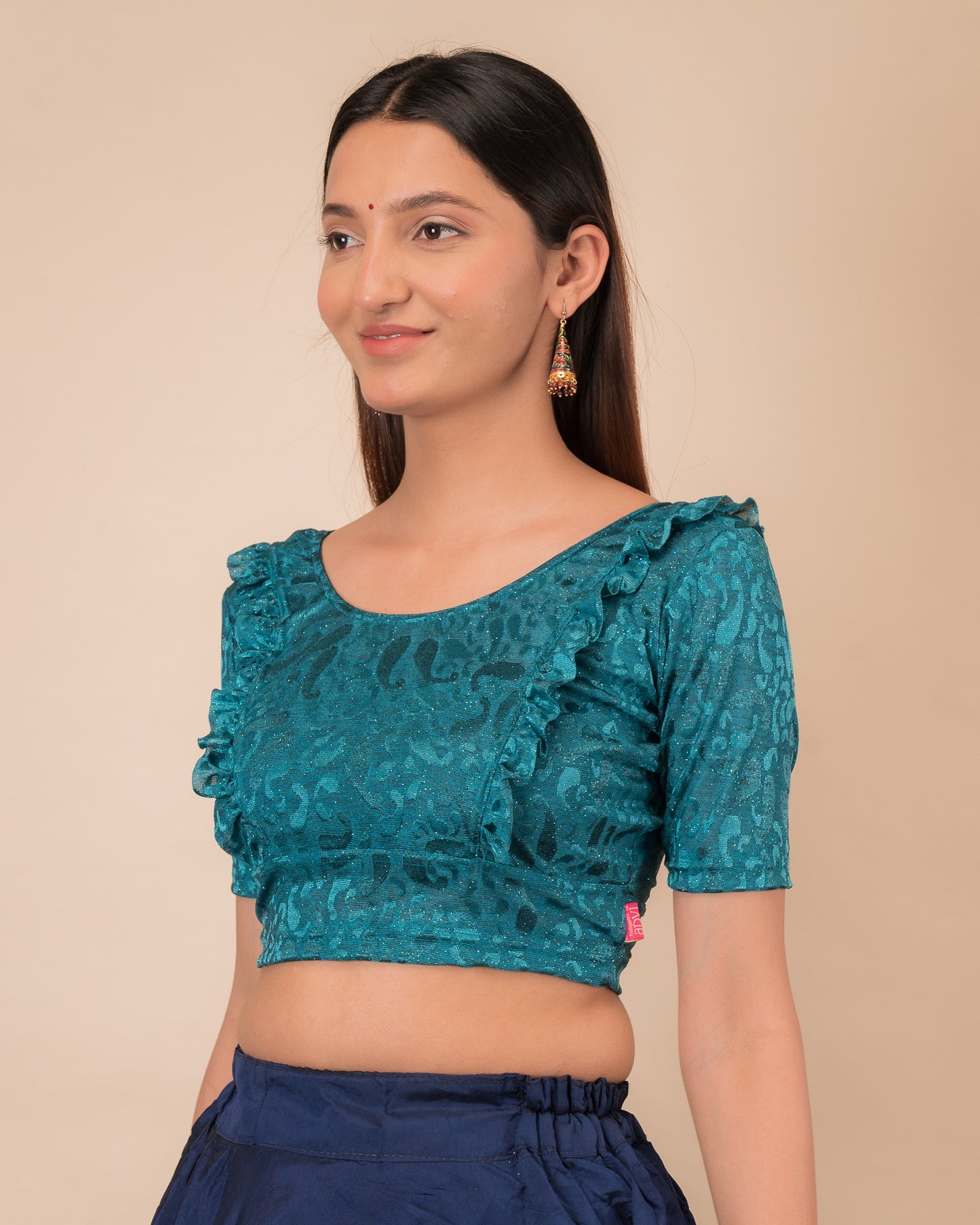 Side view highlighting the fit and shoulder ruffles.