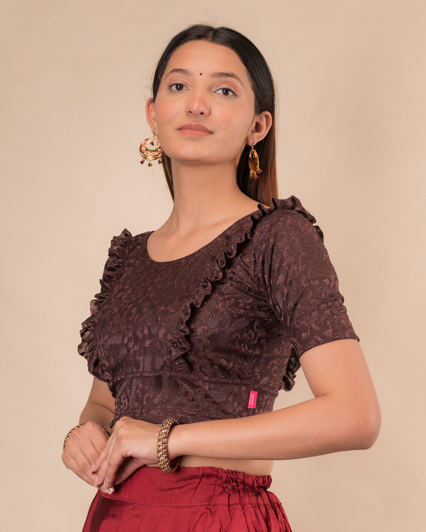 Side view highlighting the fit and shoulder ruffles