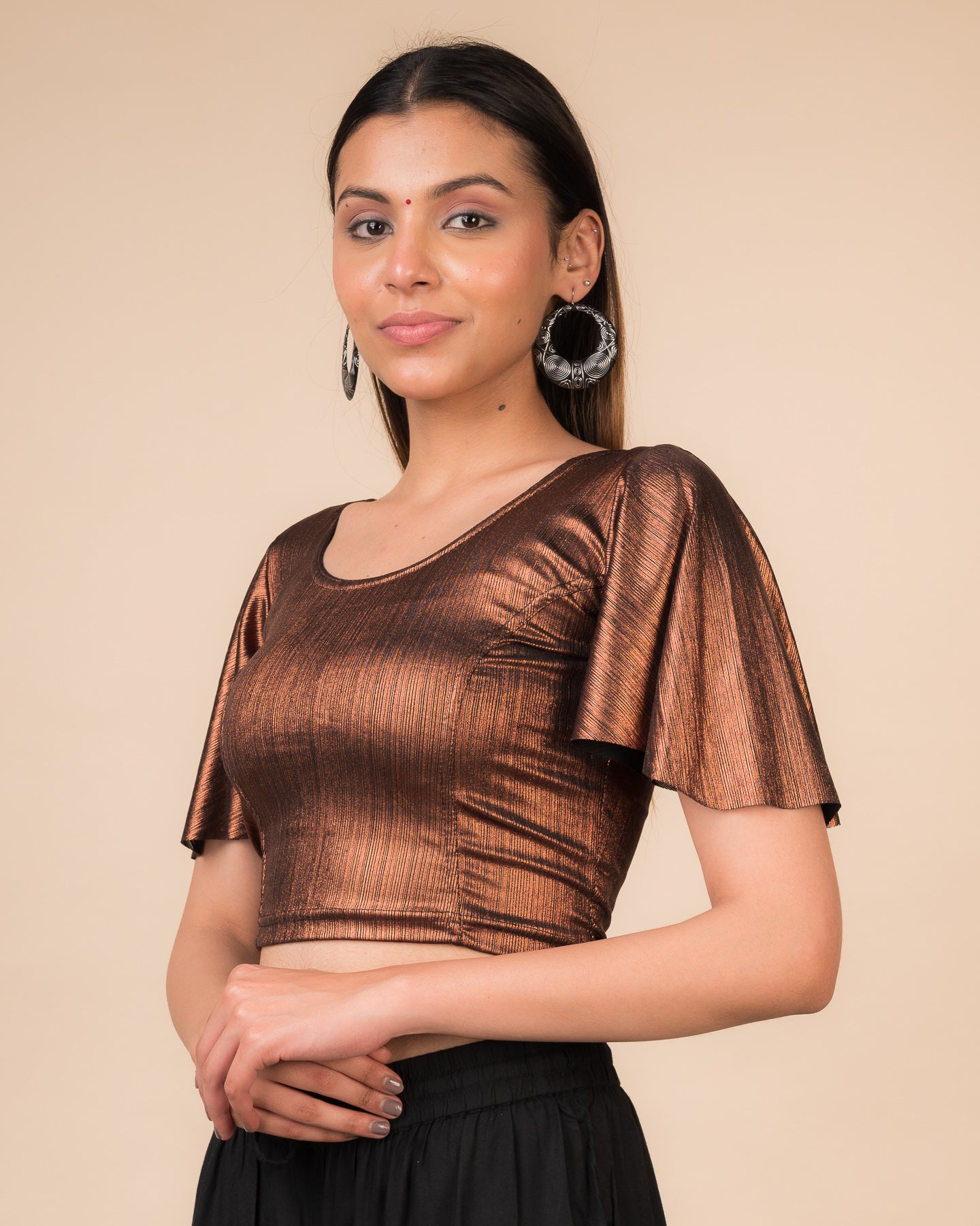 Side profile highlighting the bell sleeve drape and fit.