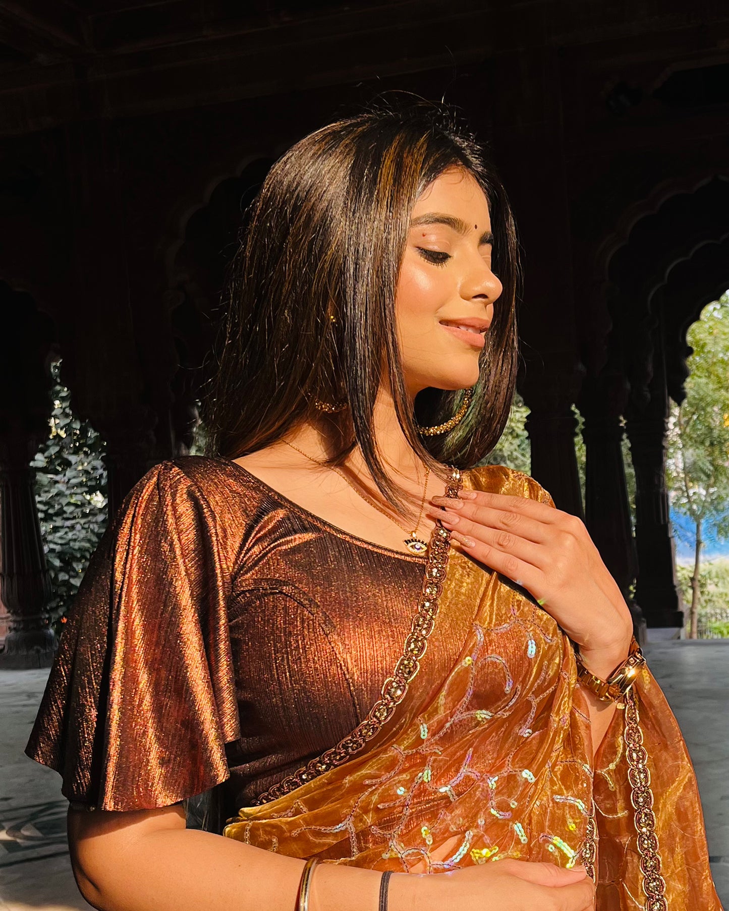 Model pairing the blouse with a saree for a festive event